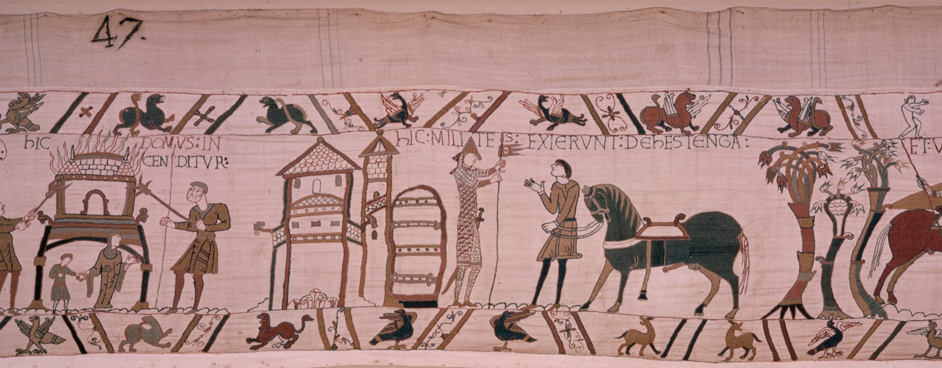 Scene from the tapestry in which William orders homes to be burned.