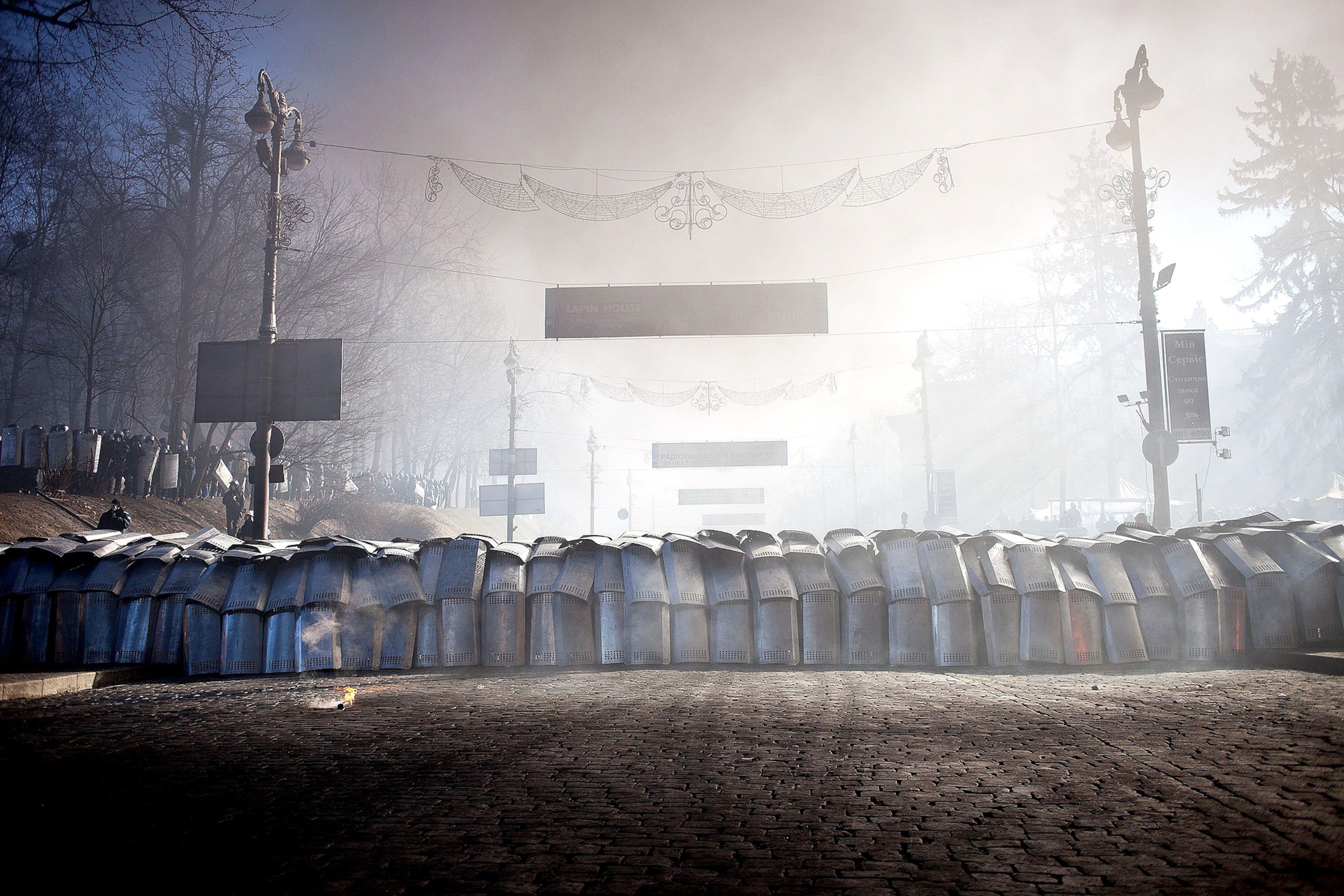 Anti-government protesters clash with riot police.