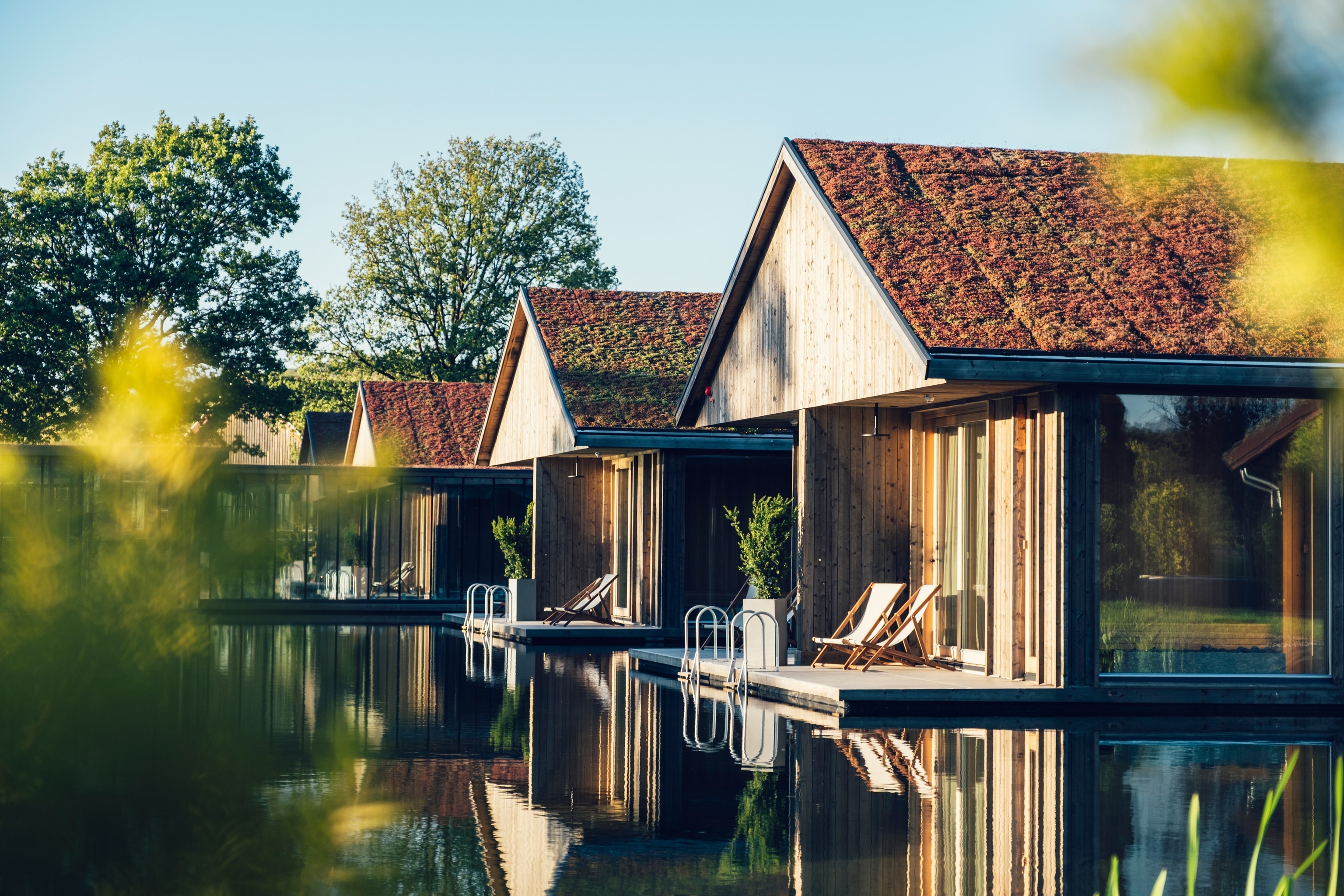 A line of boathouses overlooking a natural pool