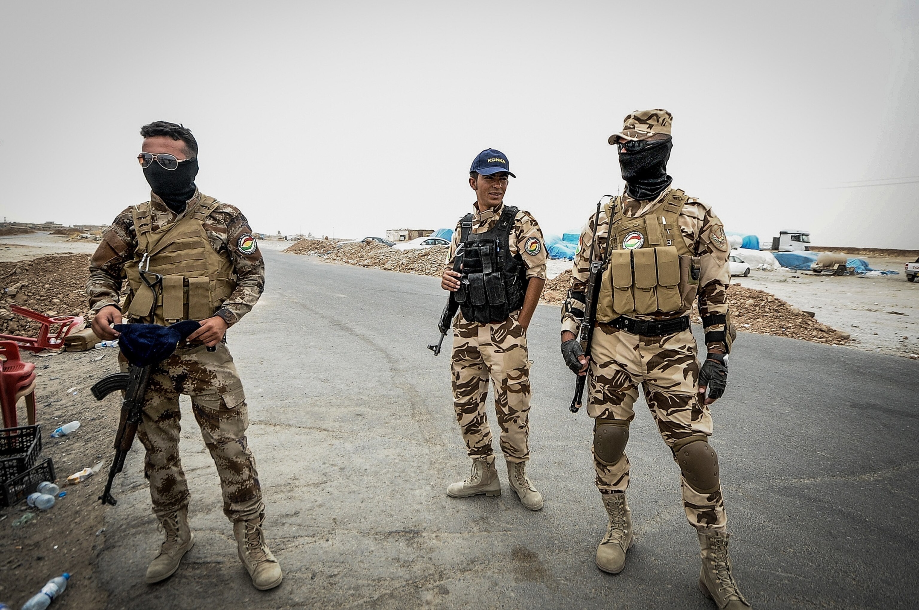 woman kissing a small boy in front of the Mar Tshmony church.