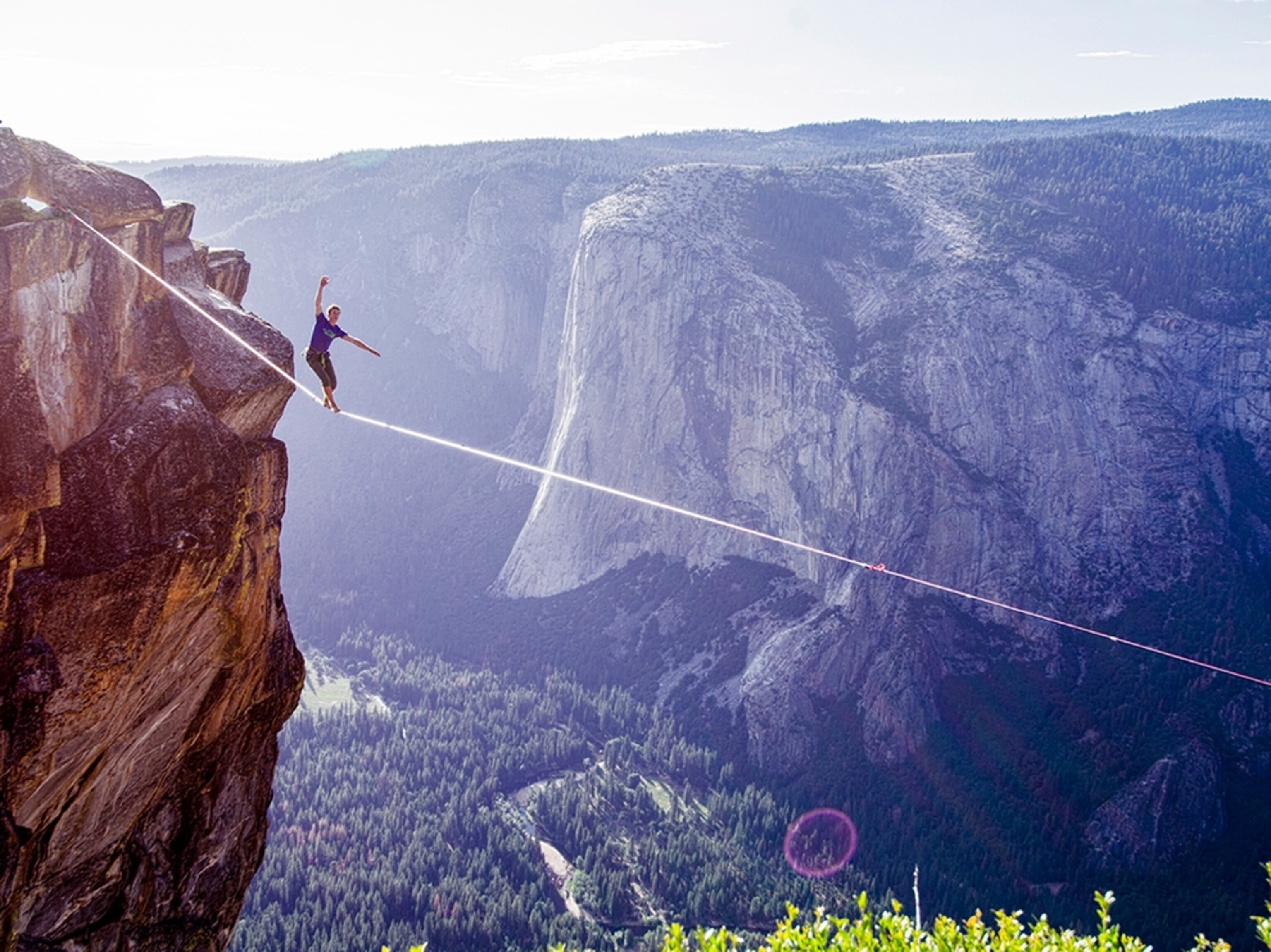 a highliner crossing a line