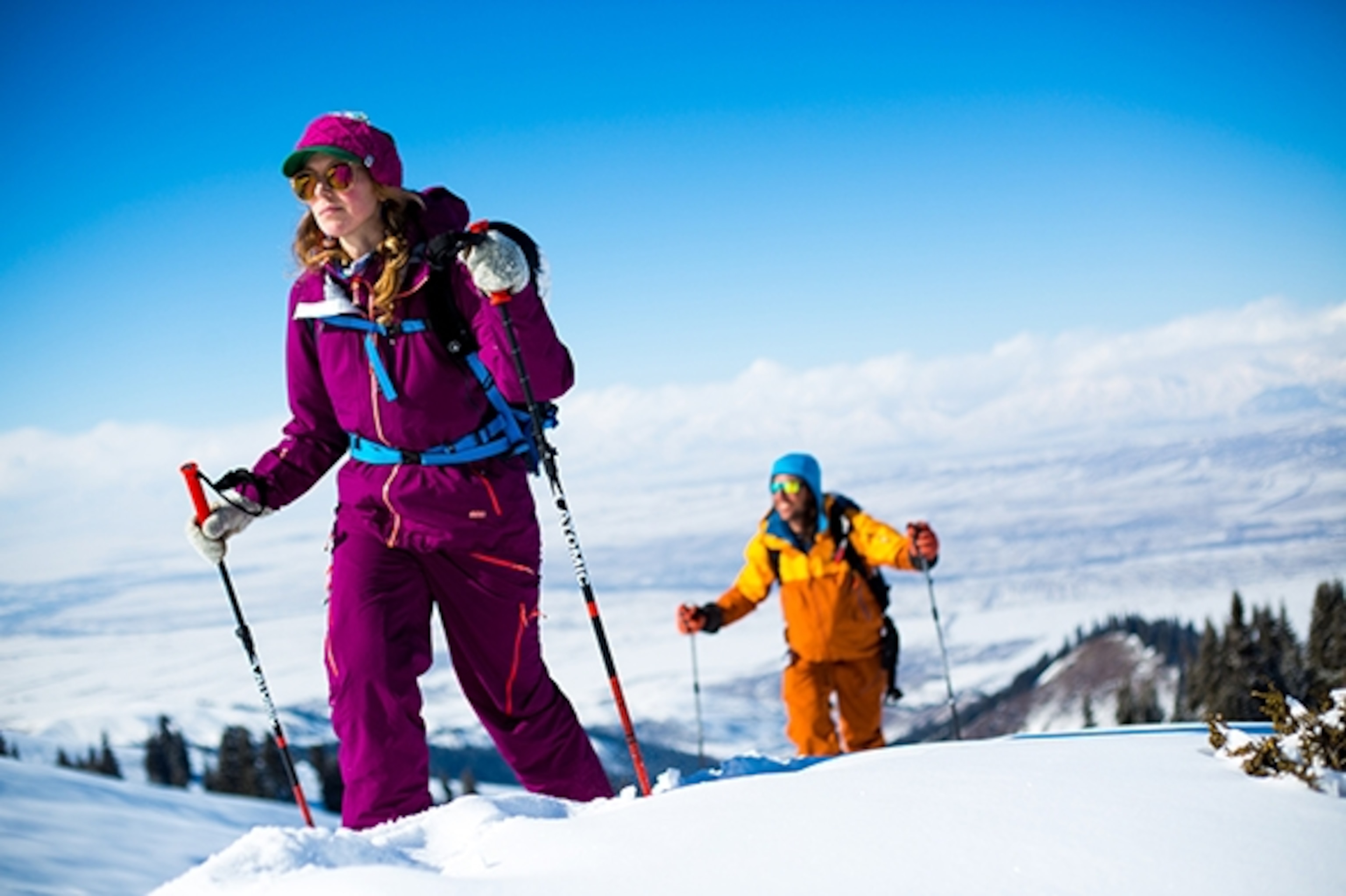 Molly Baker and Ptor Spricenieks climbing up in the afternoon sun in the Tien Shen mountain range of Kyrgyzstan; Photograph by Zoya Lynch