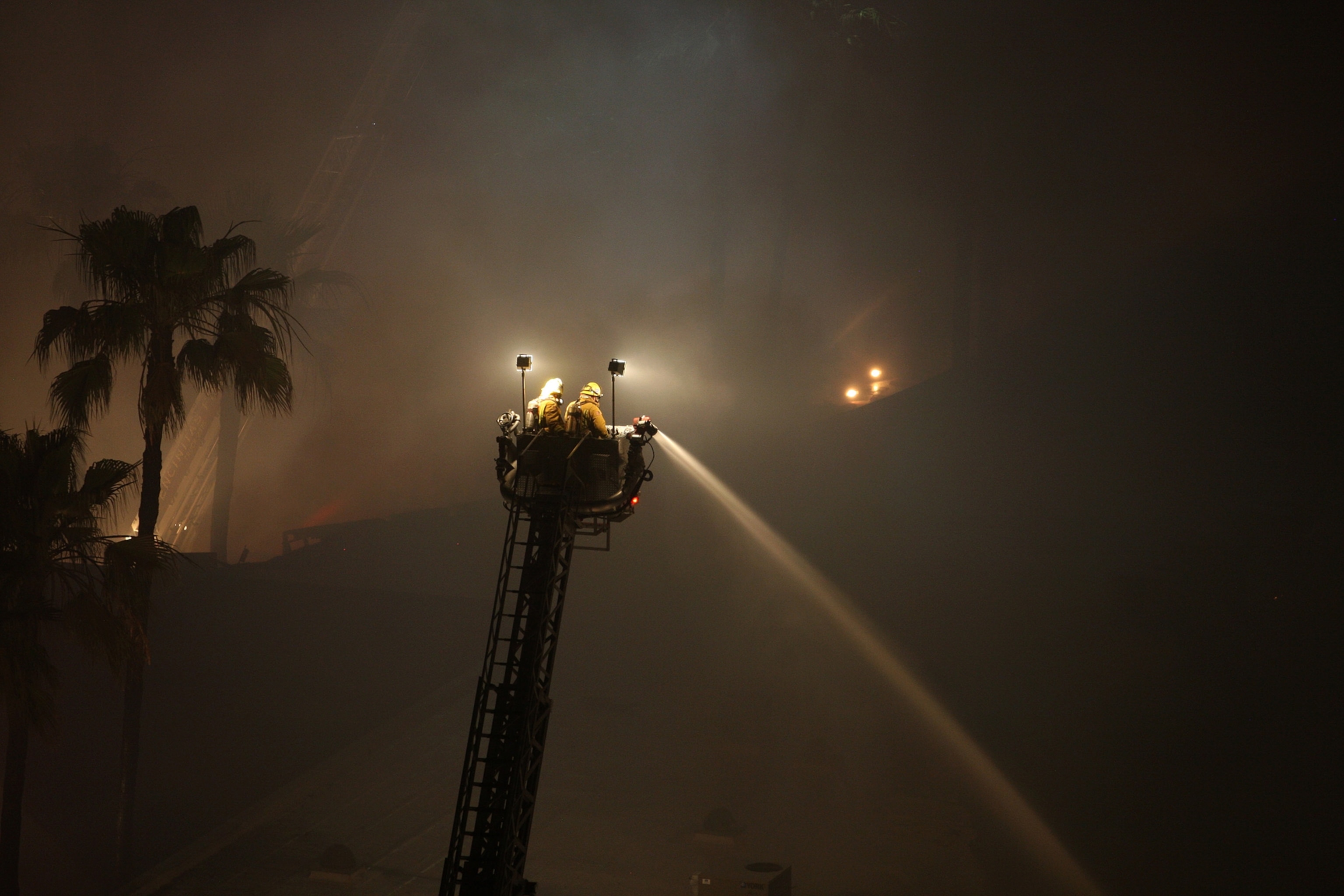 Wildfire climbs a canyon toward homes Wednesday, May 14, 2014, in Carlsbad, Calif.