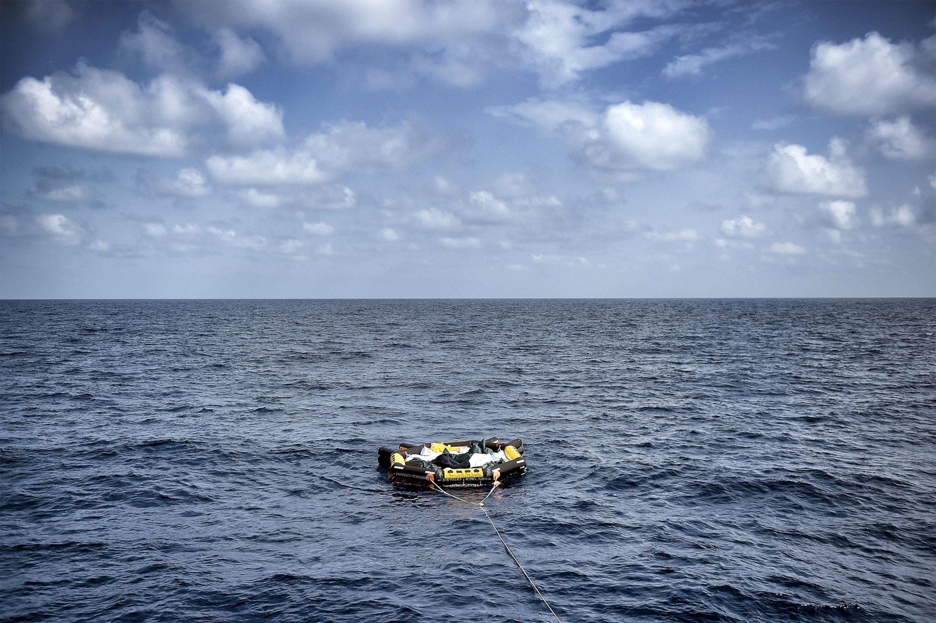 a life boat carrying dead bodies