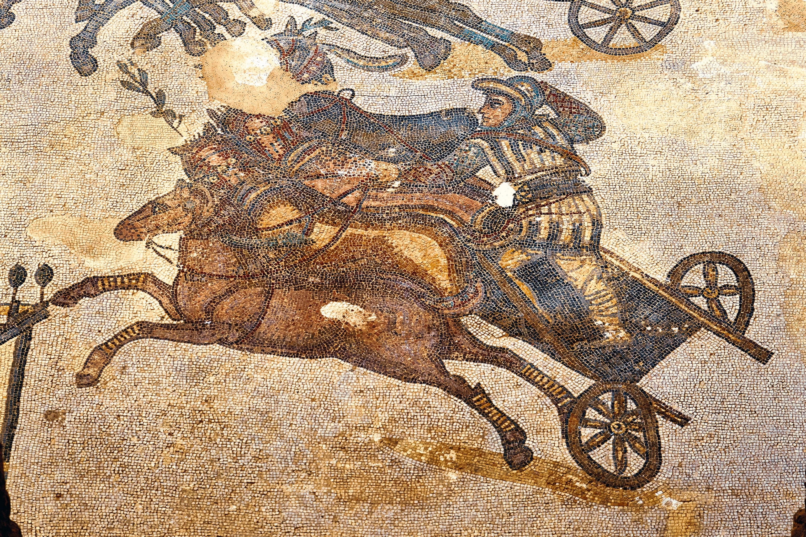 A mosaic depiction of chariot racing.