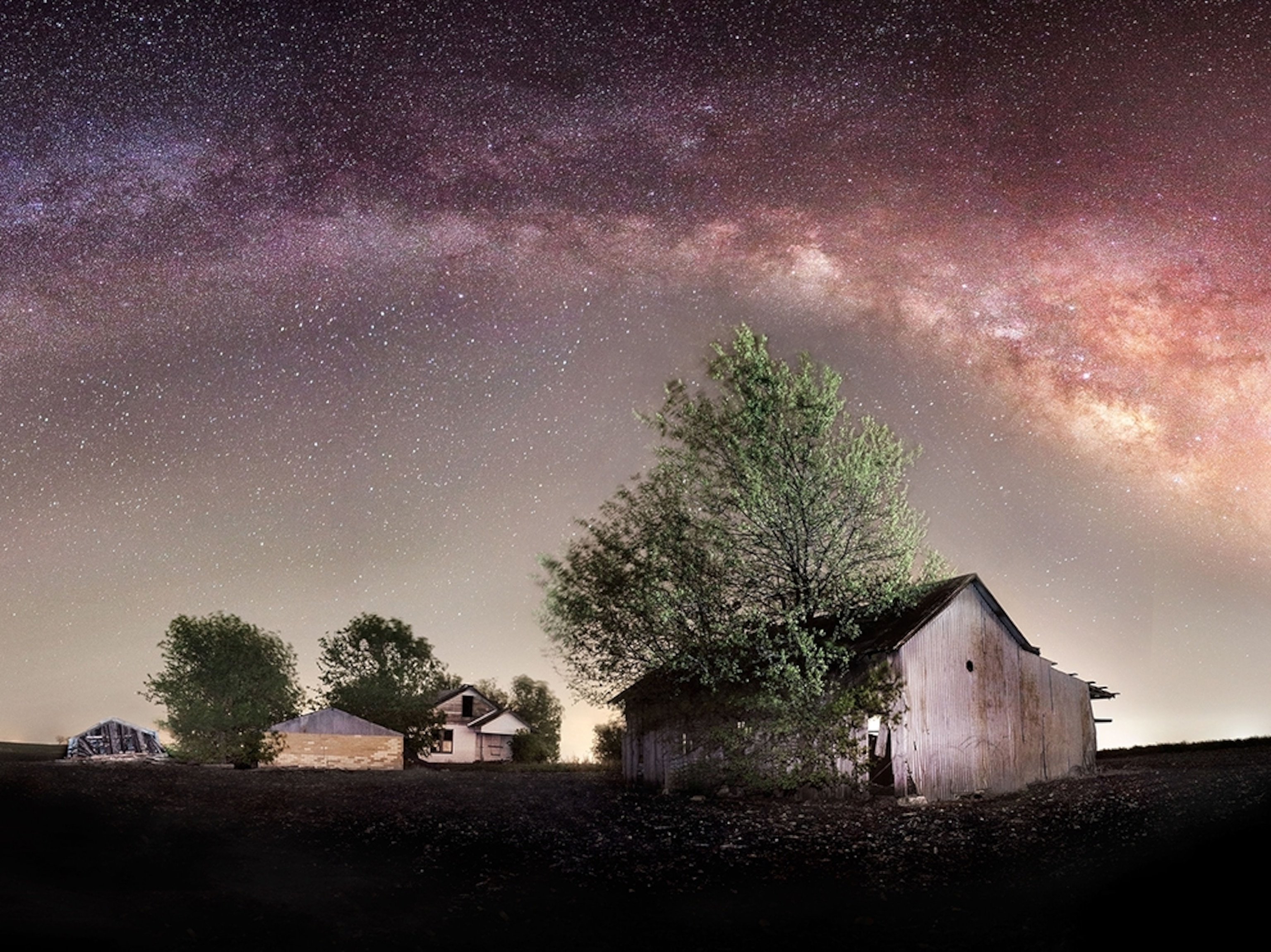 an abandoned farm under the night sky outside Bartlett, Texas
