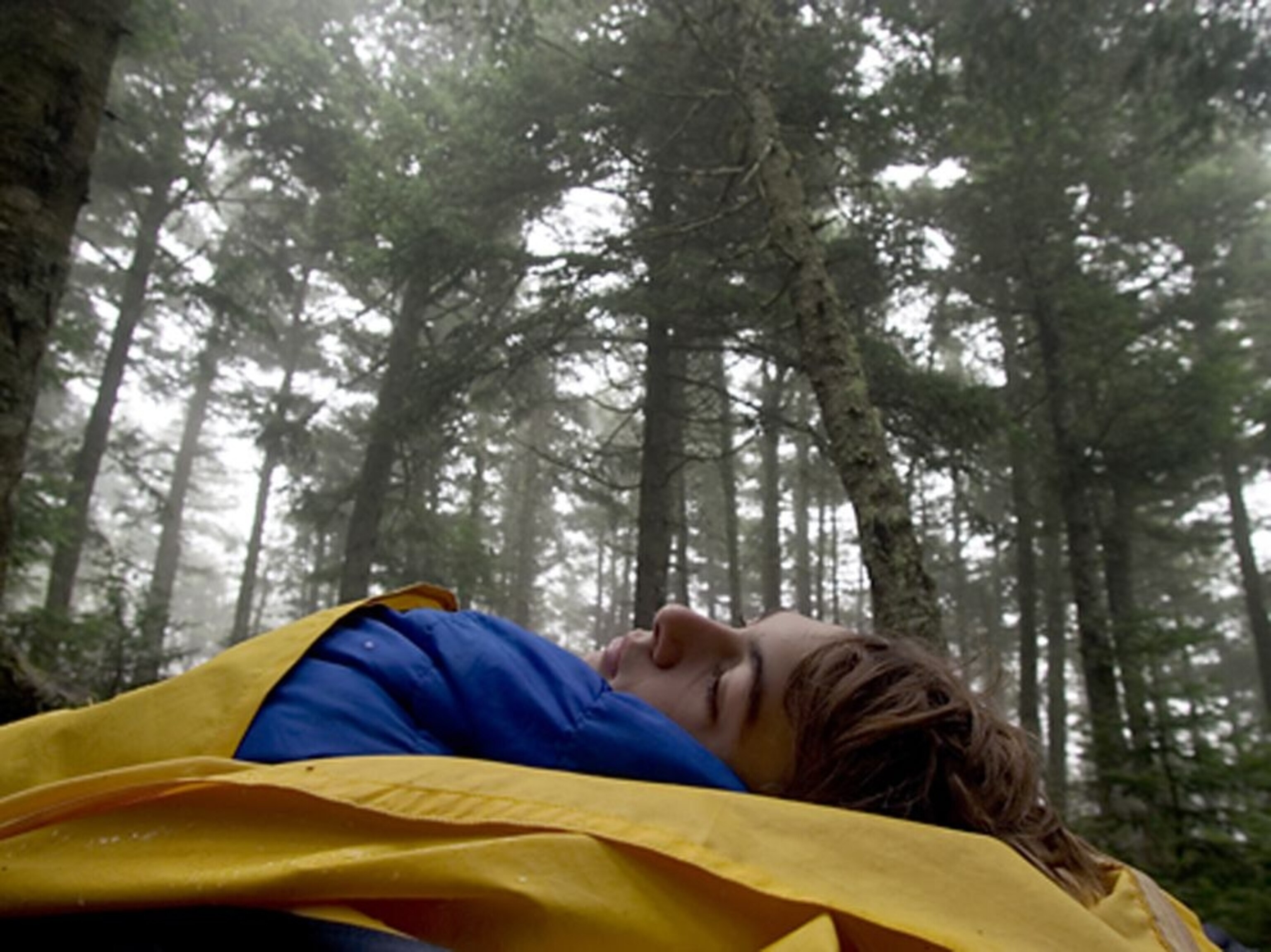 boy in a sleeping bag in Maine