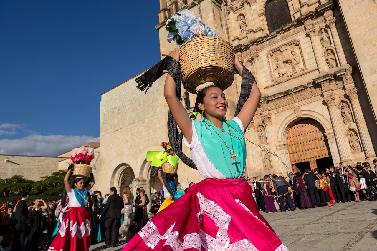 a woman performing in a folk dance for Day of the Day, Mexico