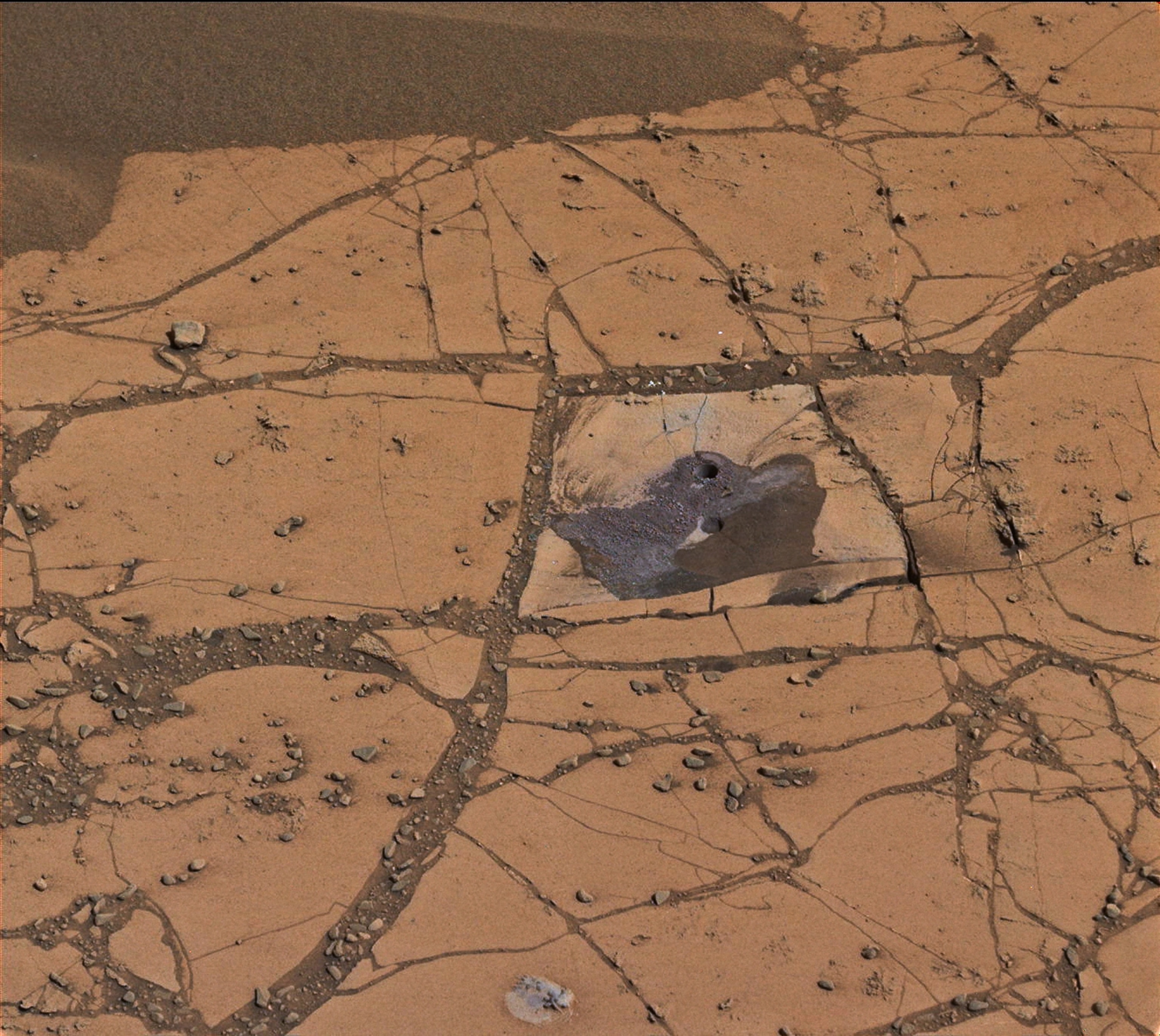 the first holes drilled by NASA's Mars rover Curiosity at Mount Sharp.