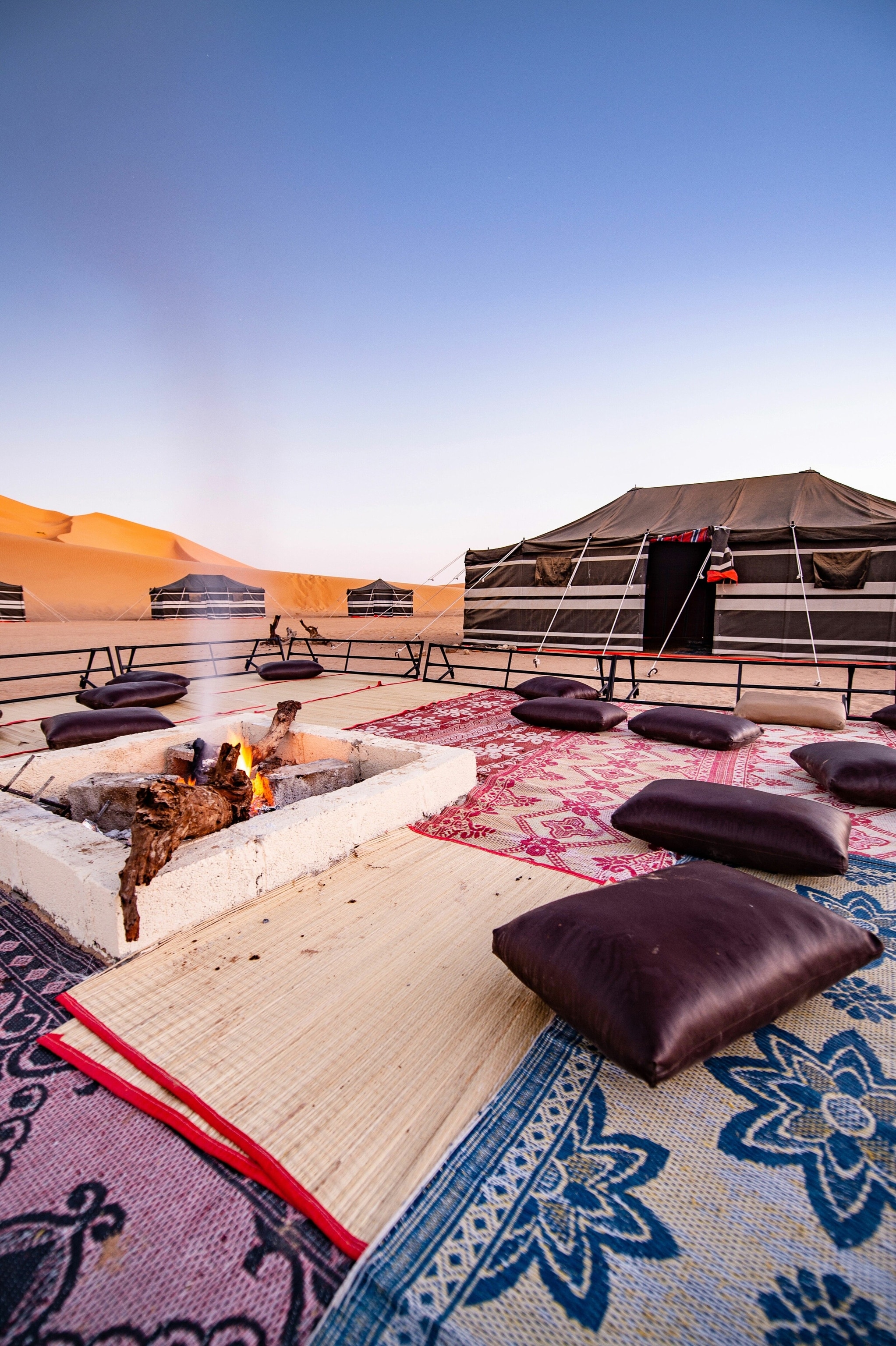 The thick, heavy fabric adorning the Al Hashman Bedouin tents provides much needed shelter from the elements and ensures a comfortable night’s sleep in the Rub' al Khali. Temperatures plummet at night, and fires are a regular fixture in every camp. Traditionally, Bedouins will sit in a circle sharing food and stories; tales of ancient cities and civilisations now lost beneath the sand.