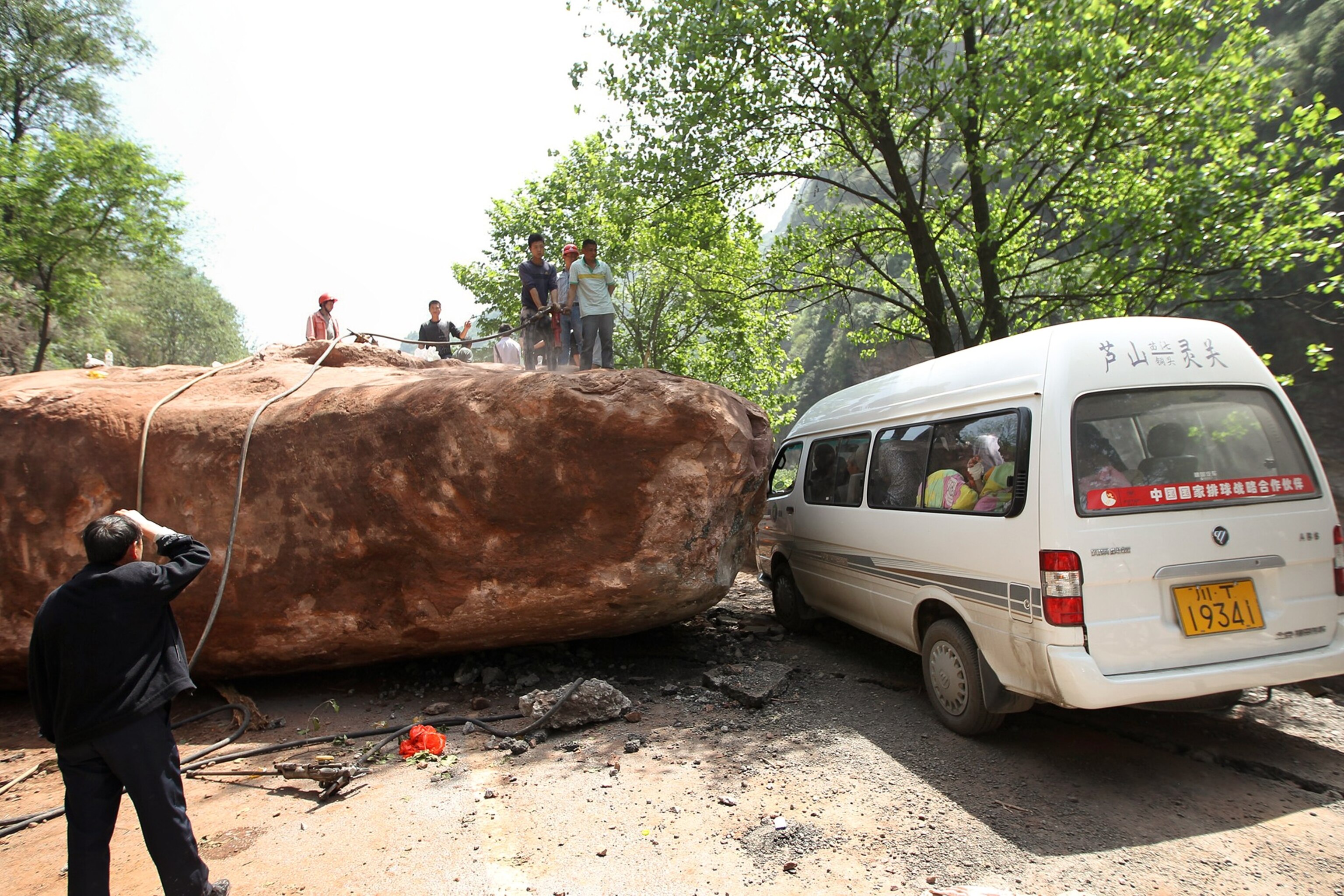 China earthquake picture: A fallen rock blocks a road