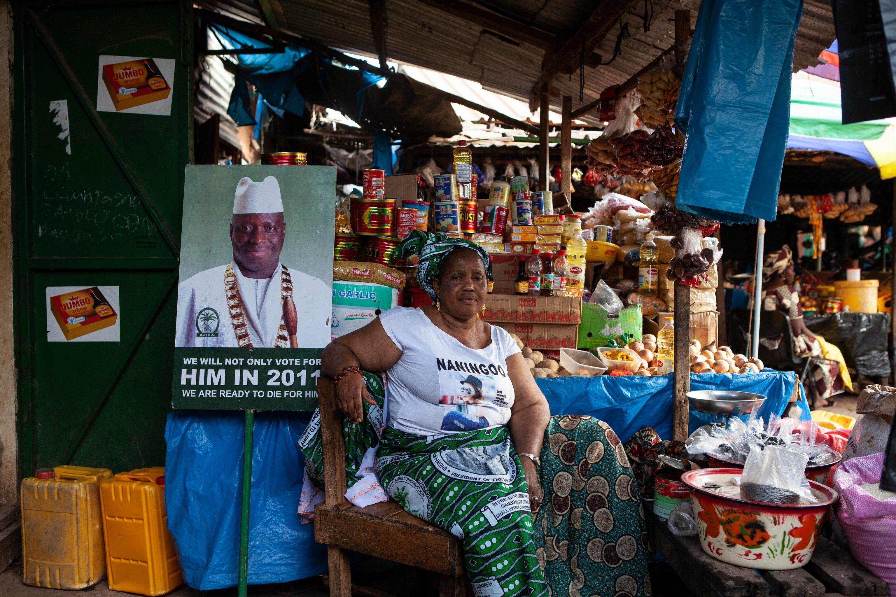 A supporter of the former dictator Yahya Jammeh at her stall in the market at Bansang town.