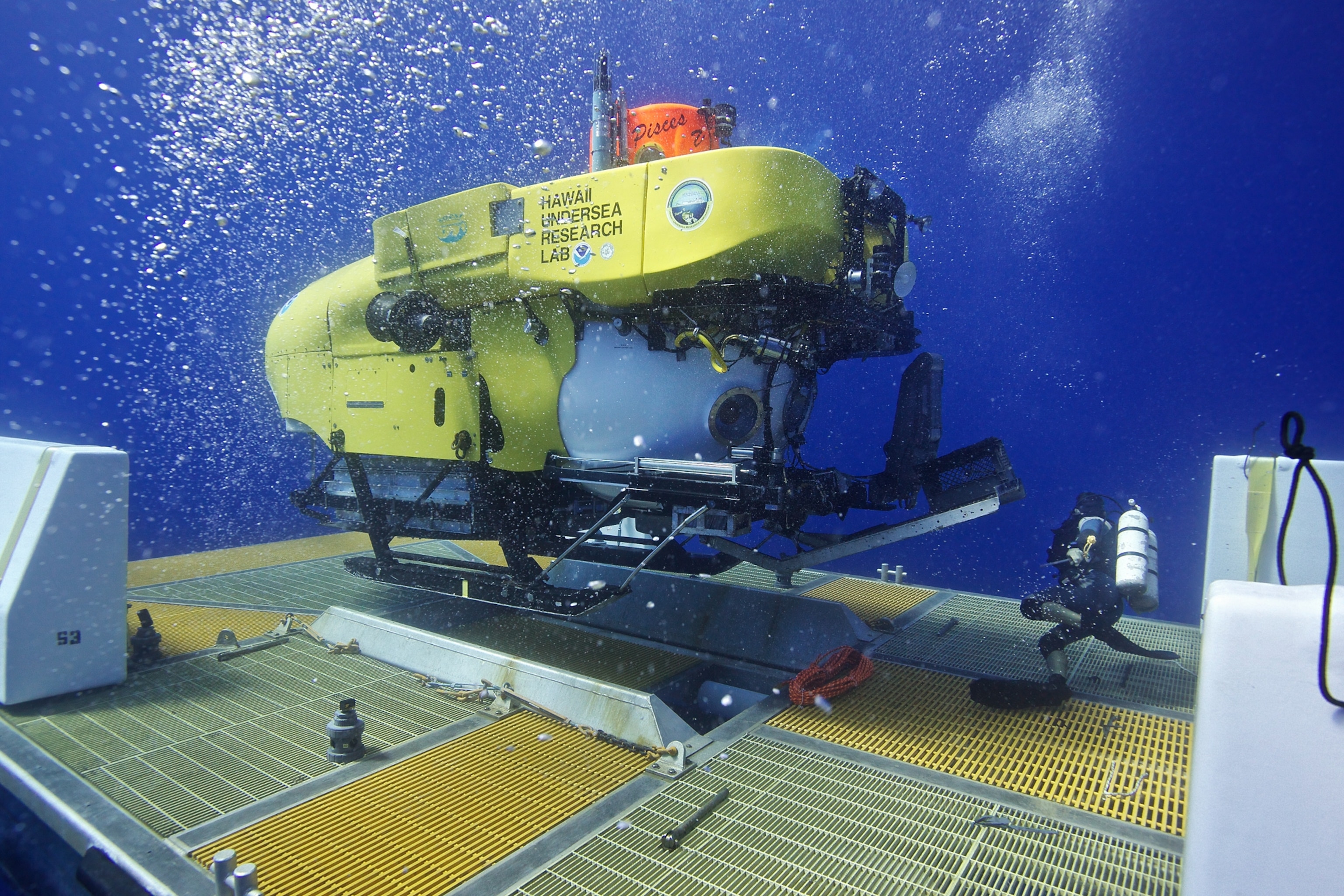 The Pisces V deep-diving manned submersible being launched from a towed launch-recovery-transport (LRT) platform off of the coast of Oahu, Hawaii.