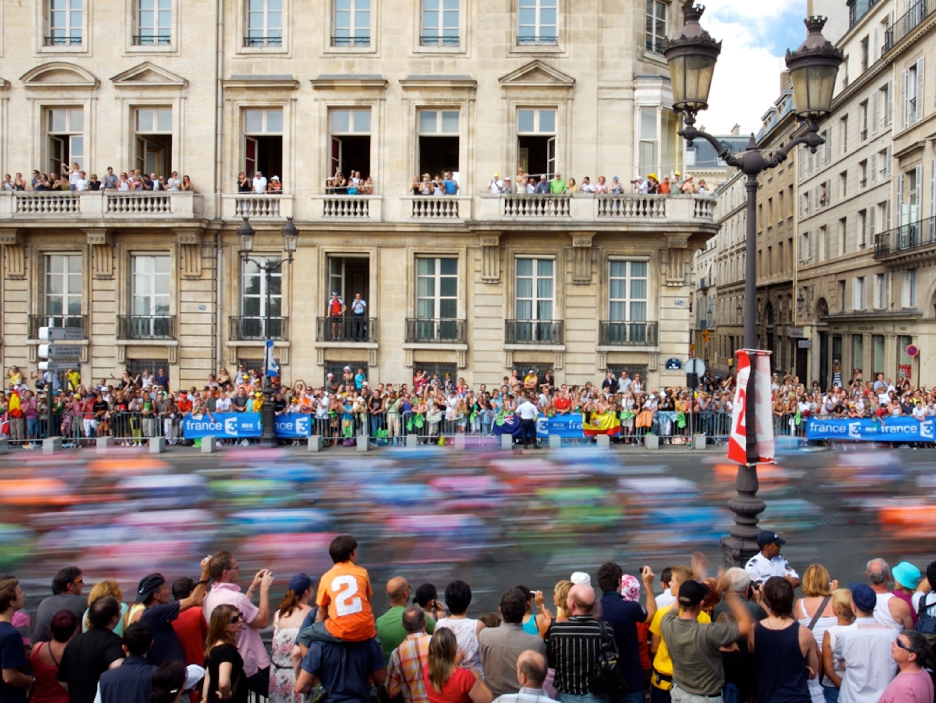 Cyclists racing through Paris streets