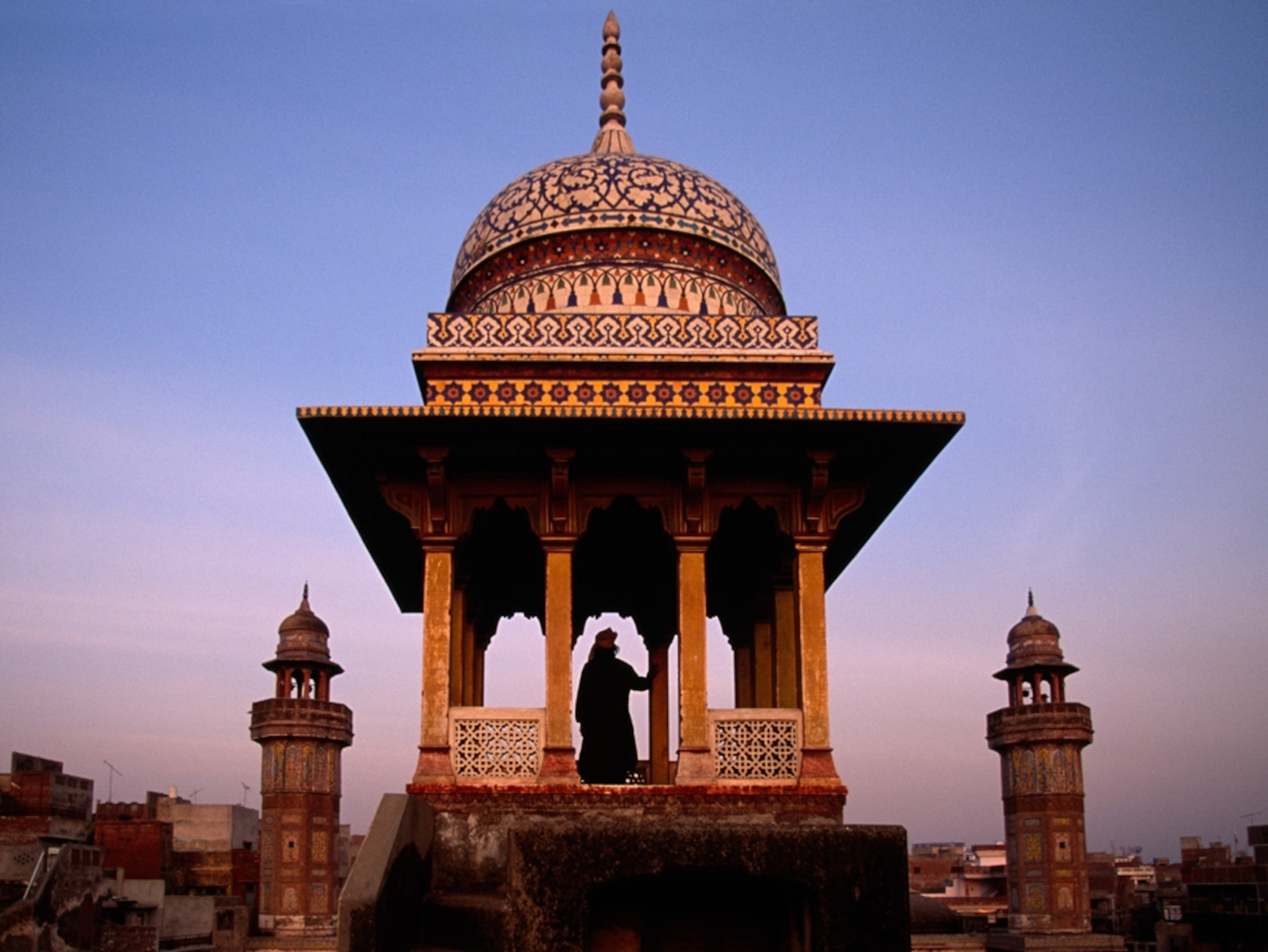 A man standing under a dome