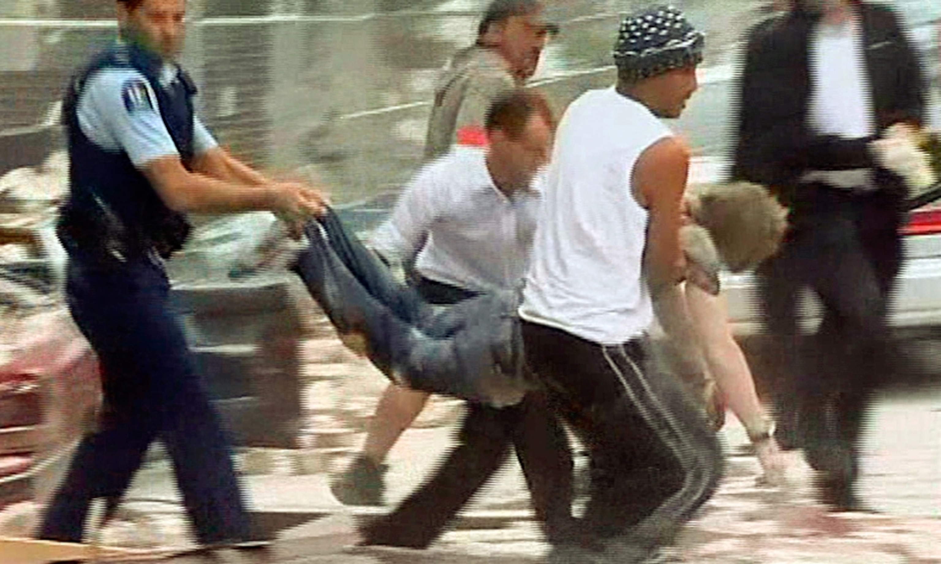 Earthquake in New Zealand (pictures): A wounded man is carried from the rubble after the New Zealand earthquake