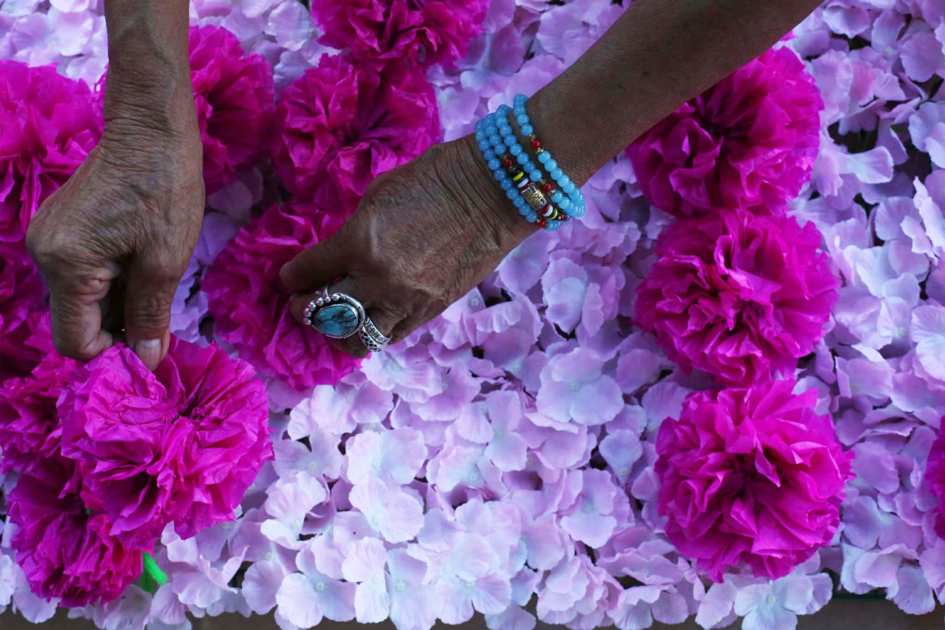 Detail of a flower altar being made to celebrate day of the dead