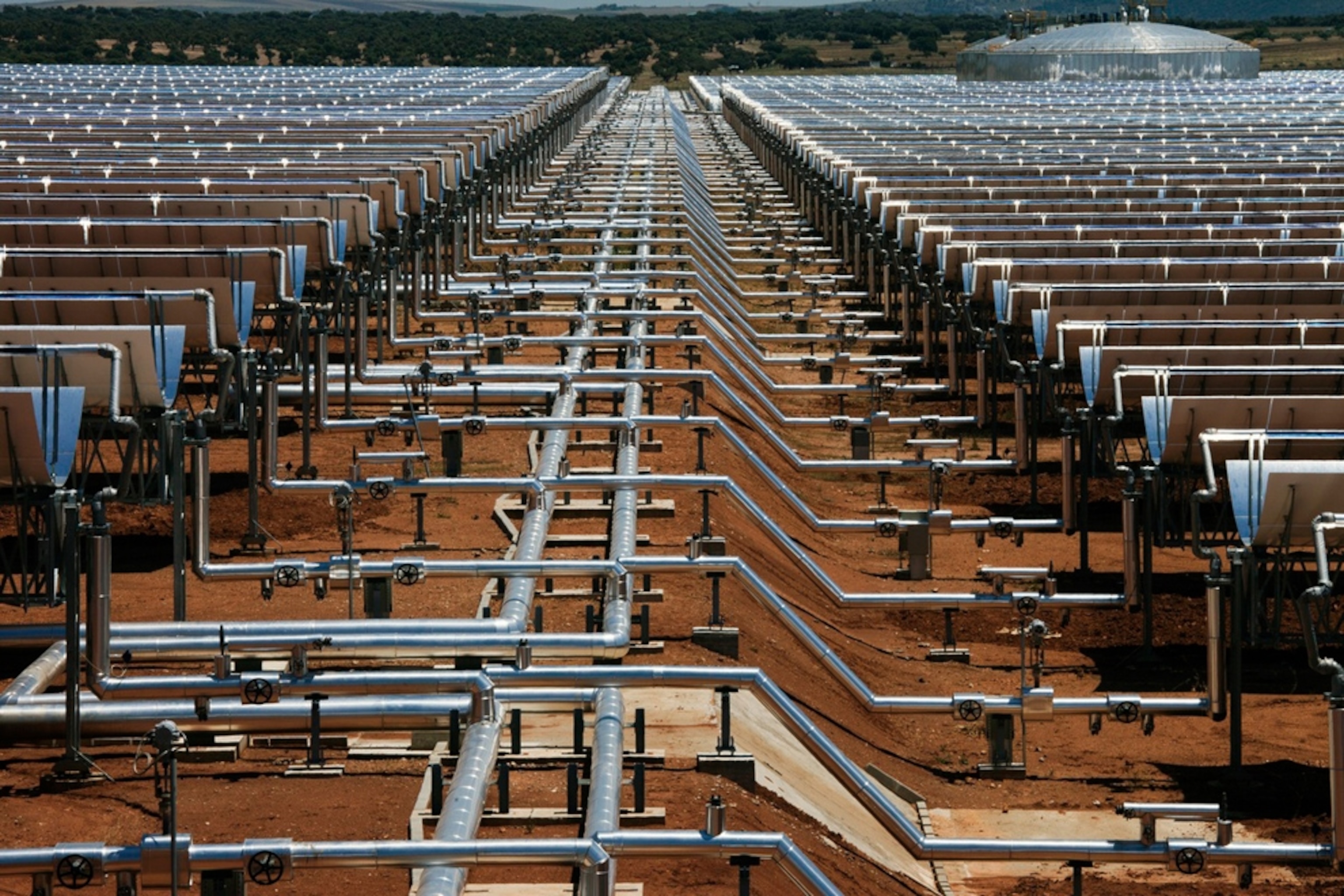 Views of parabolic mirrors lined up at La Dehesa, a solar plant in La Garovilla, Spain