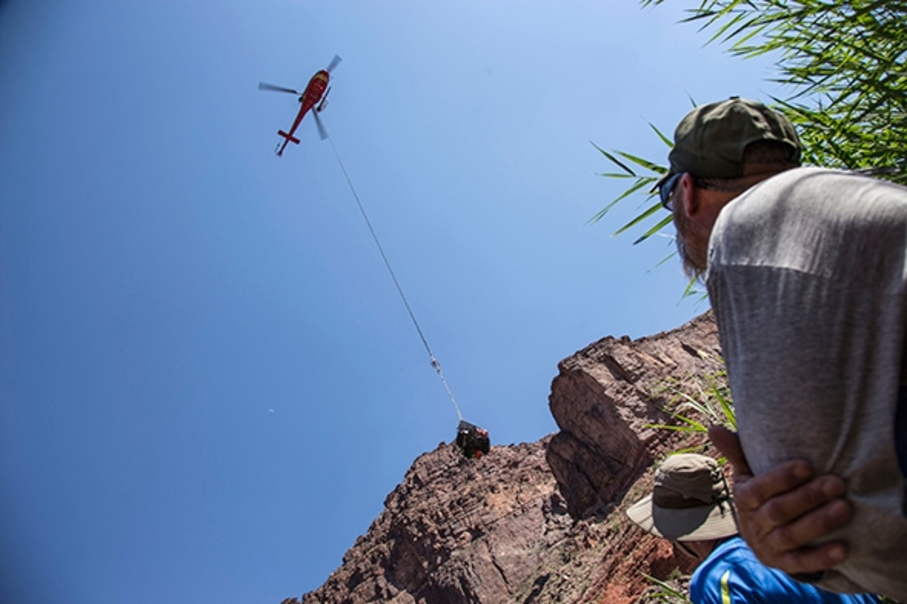 The NPS Search & Rescue helicopter drops off another load of supplies; Photograph by Danny Schmidt