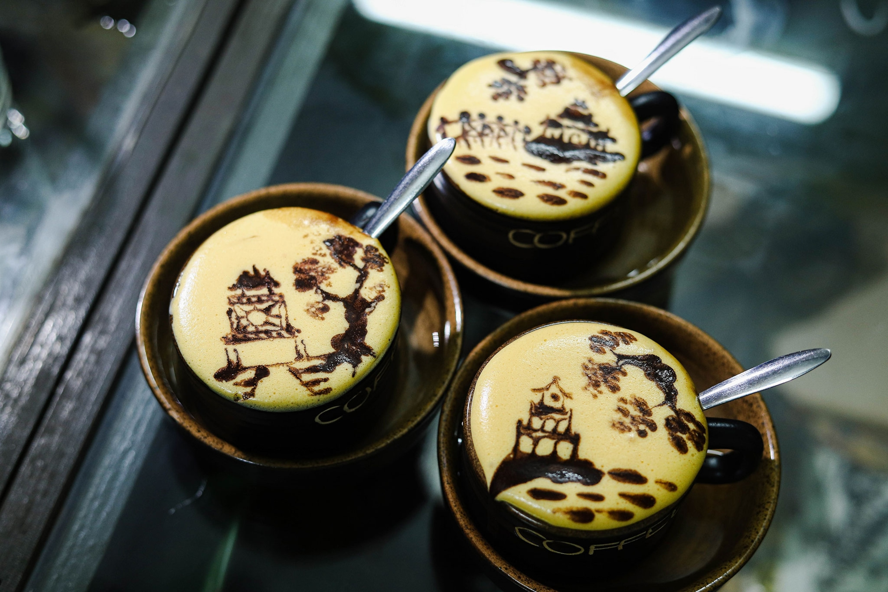 Egg coffee with patterns of Hanoi's landmarks at a coffee shop in the Old Quarter in Vietnam's capital Hanoi.