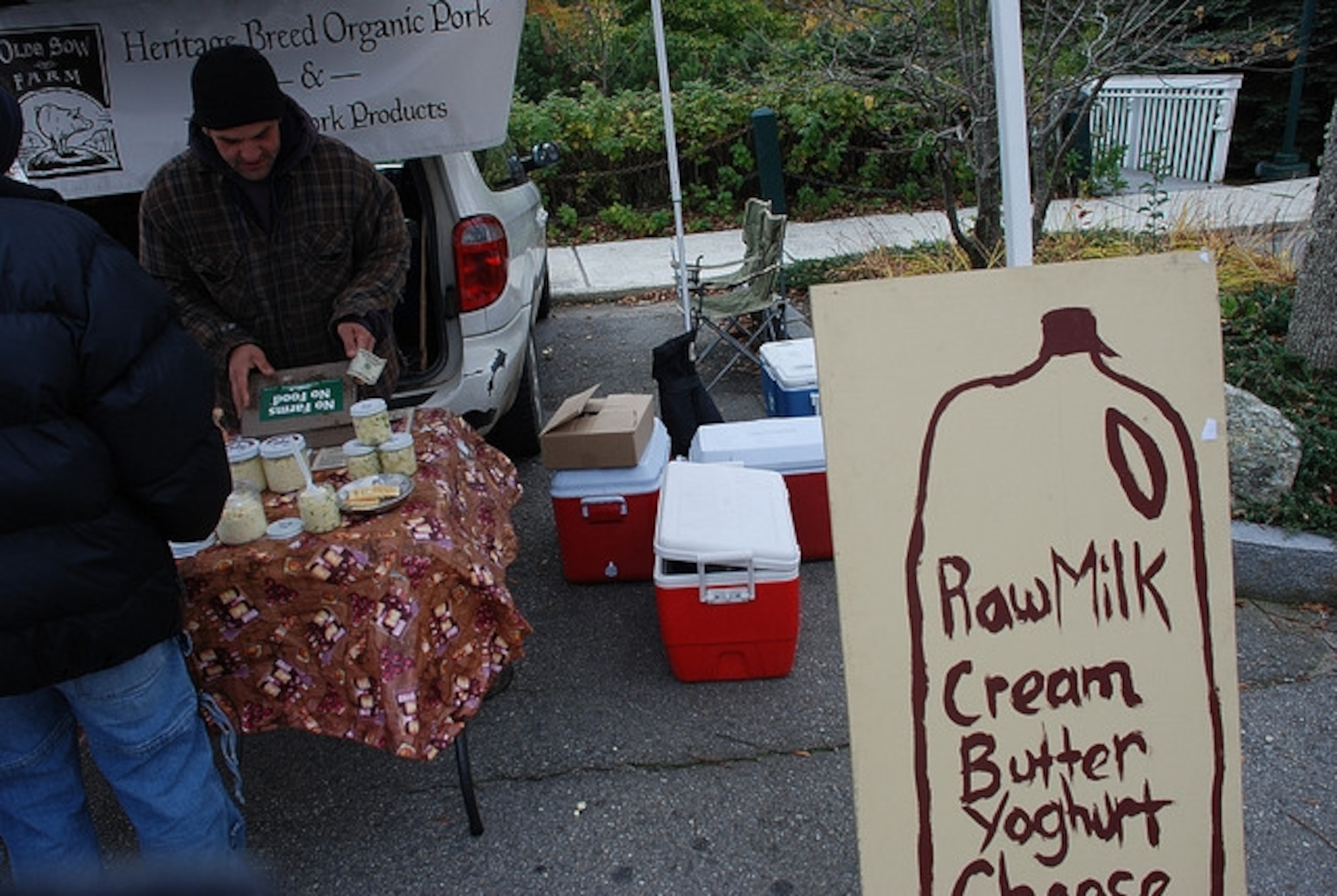 a farmer selling raw milk.