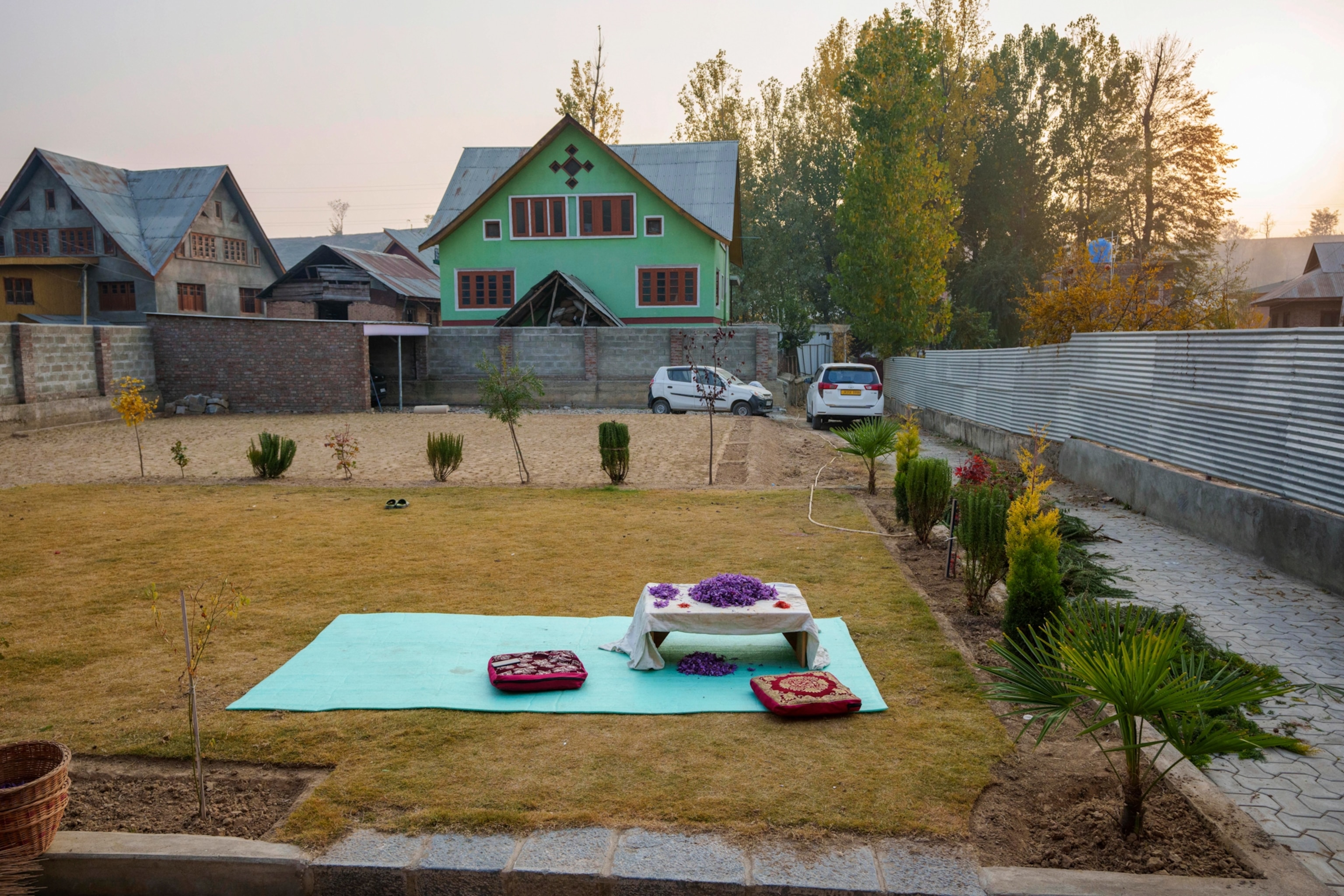 A light blue blanket strewn on the ground.