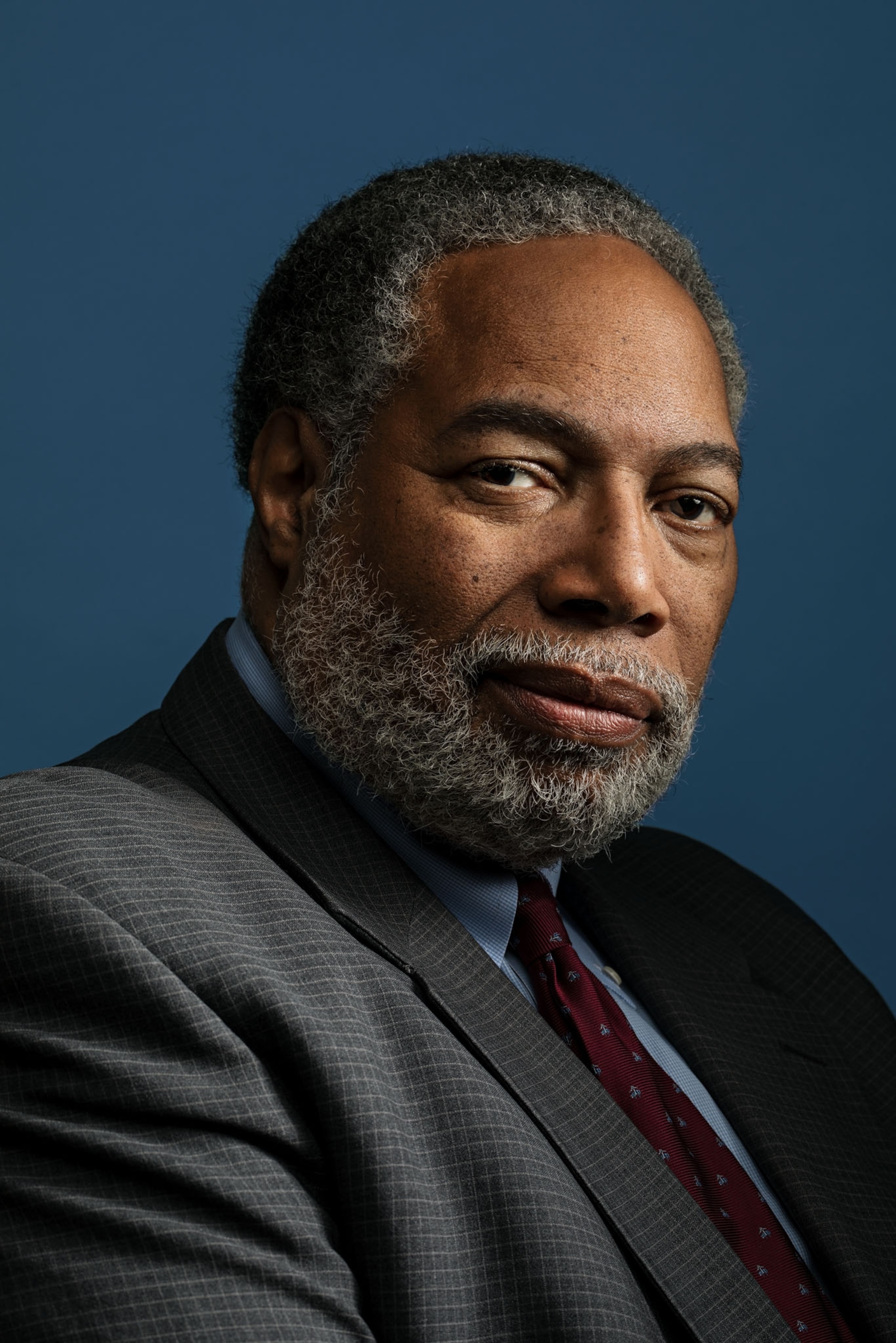 lonnie bunch in a suit against a blue background