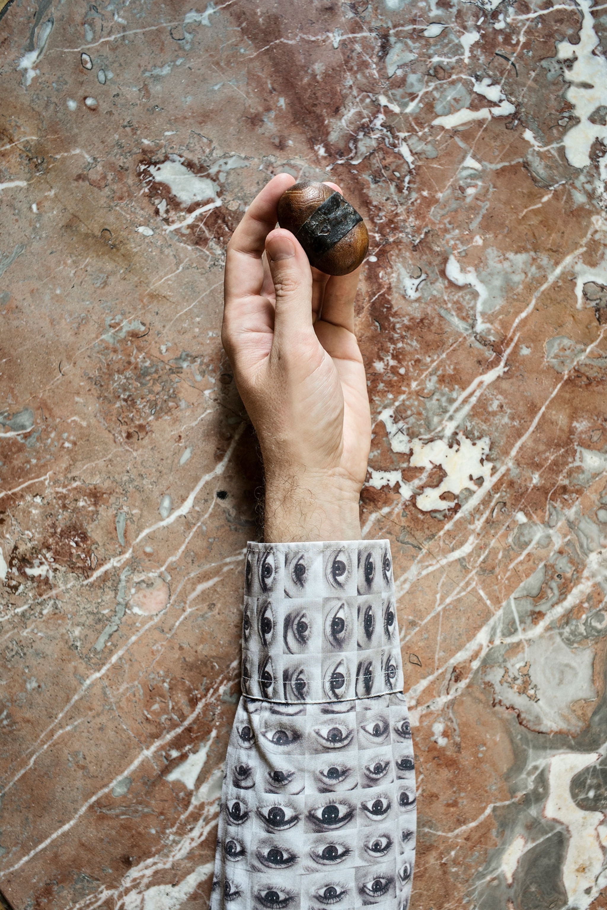 Thomas Hardwick holds his lucky stone with ancient leather wrapped around it