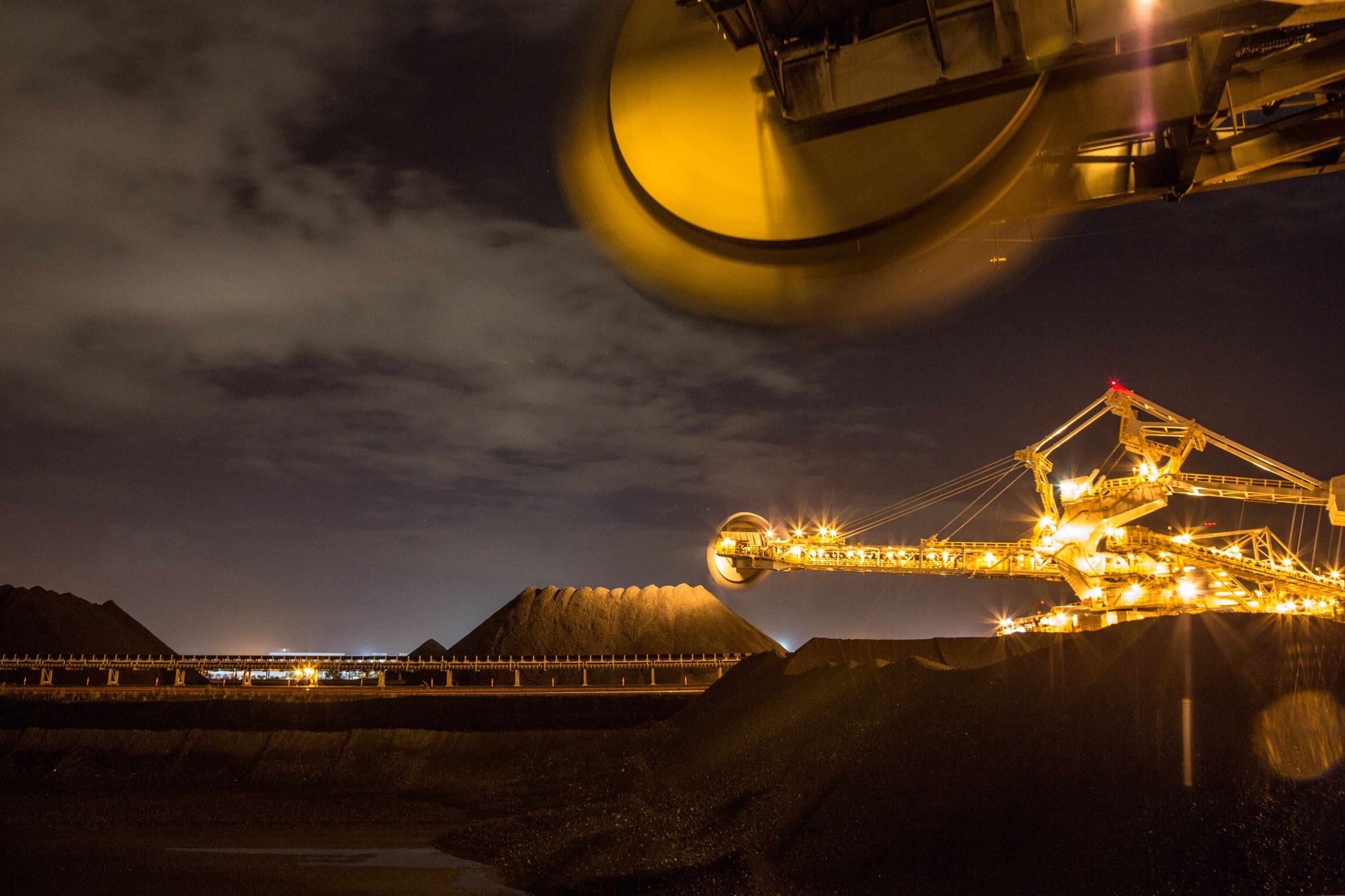 The Black Thunder min, one of the world's largest, covers 75 square miles of public and private land. Trucks the size of houses haul more than 90 million tons of coal a year to trains, which carry most of it to eastern power plants.
