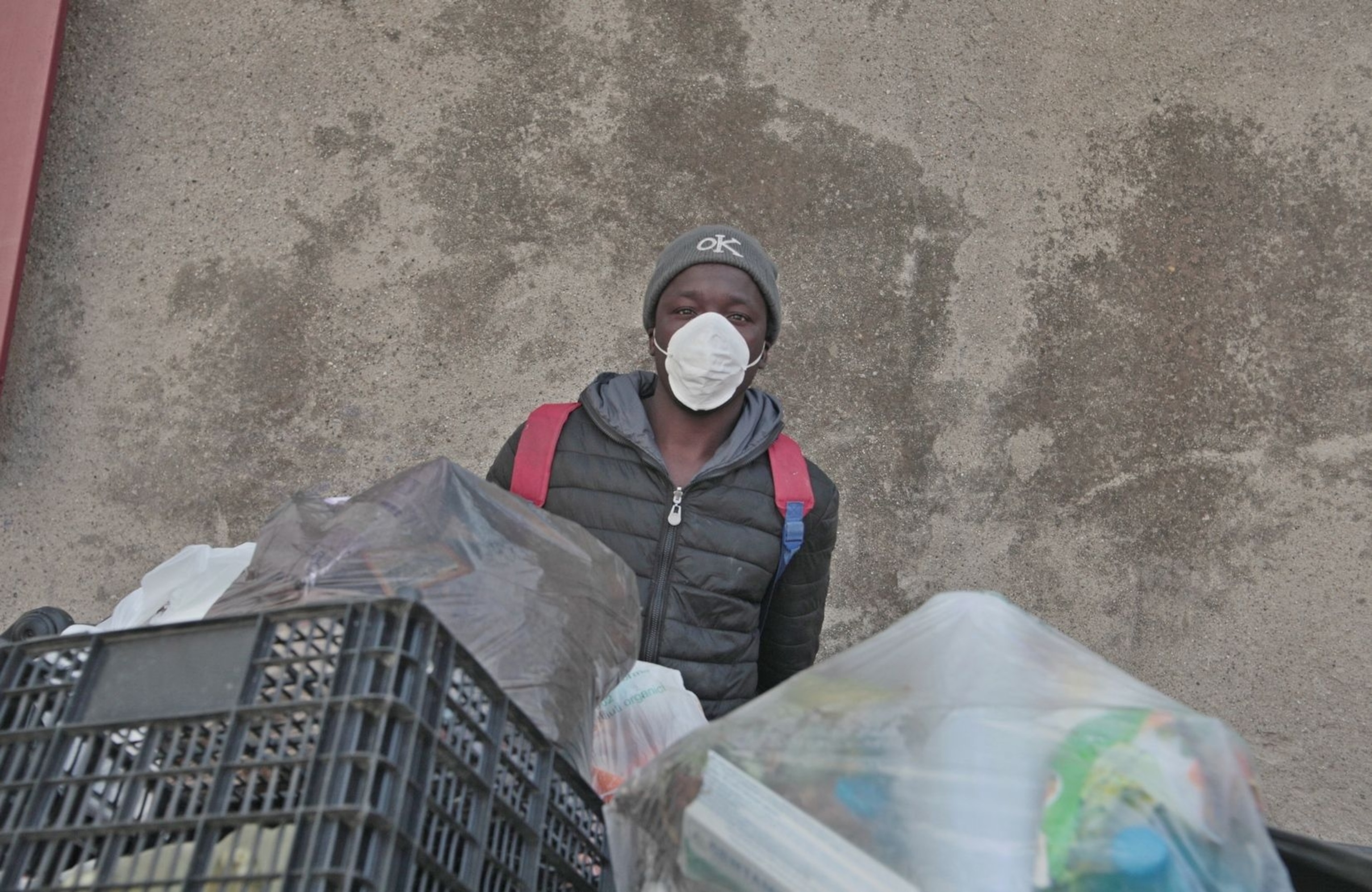 Teen migrant combs trash for things to sell