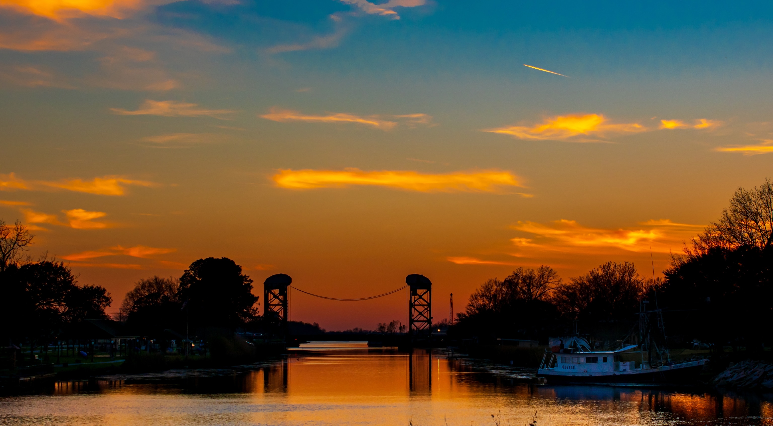the historical Lockport Company Canal Bridge at sunset