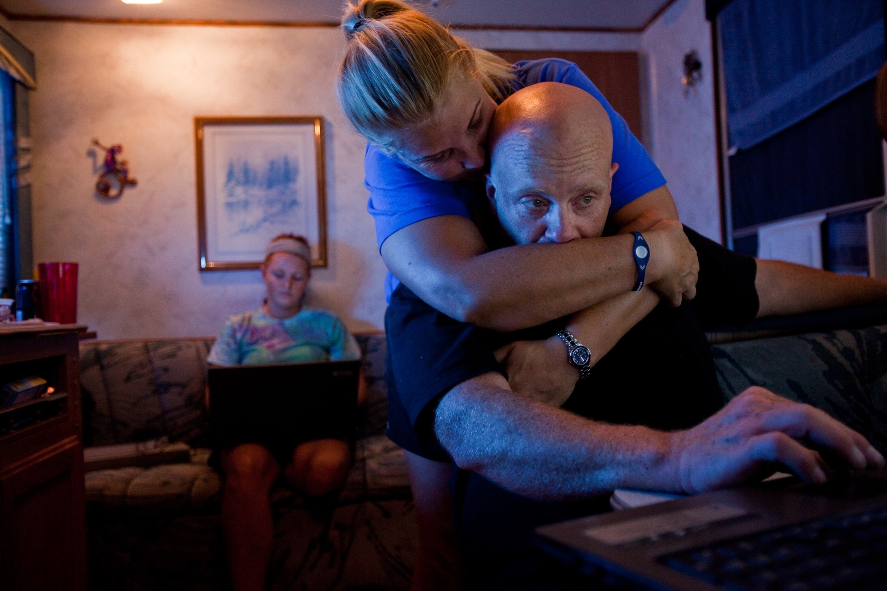 How Joplin Recovered - A woman hugs her husband in their Joplin, Missouri RV.