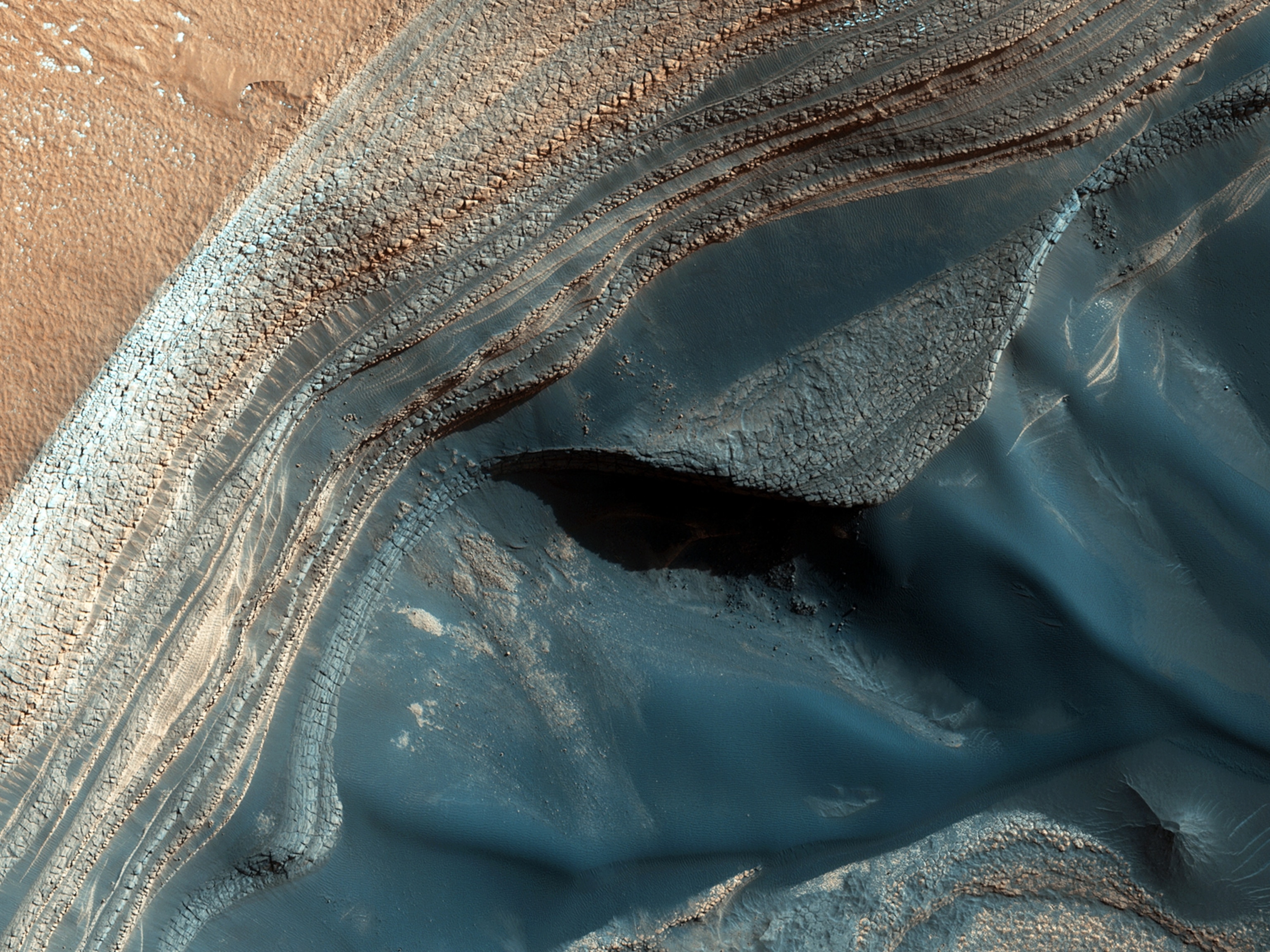 The North Polar layered deposits (NPLD) are a stack of layers of ice and dust at the North Pole of Mars.