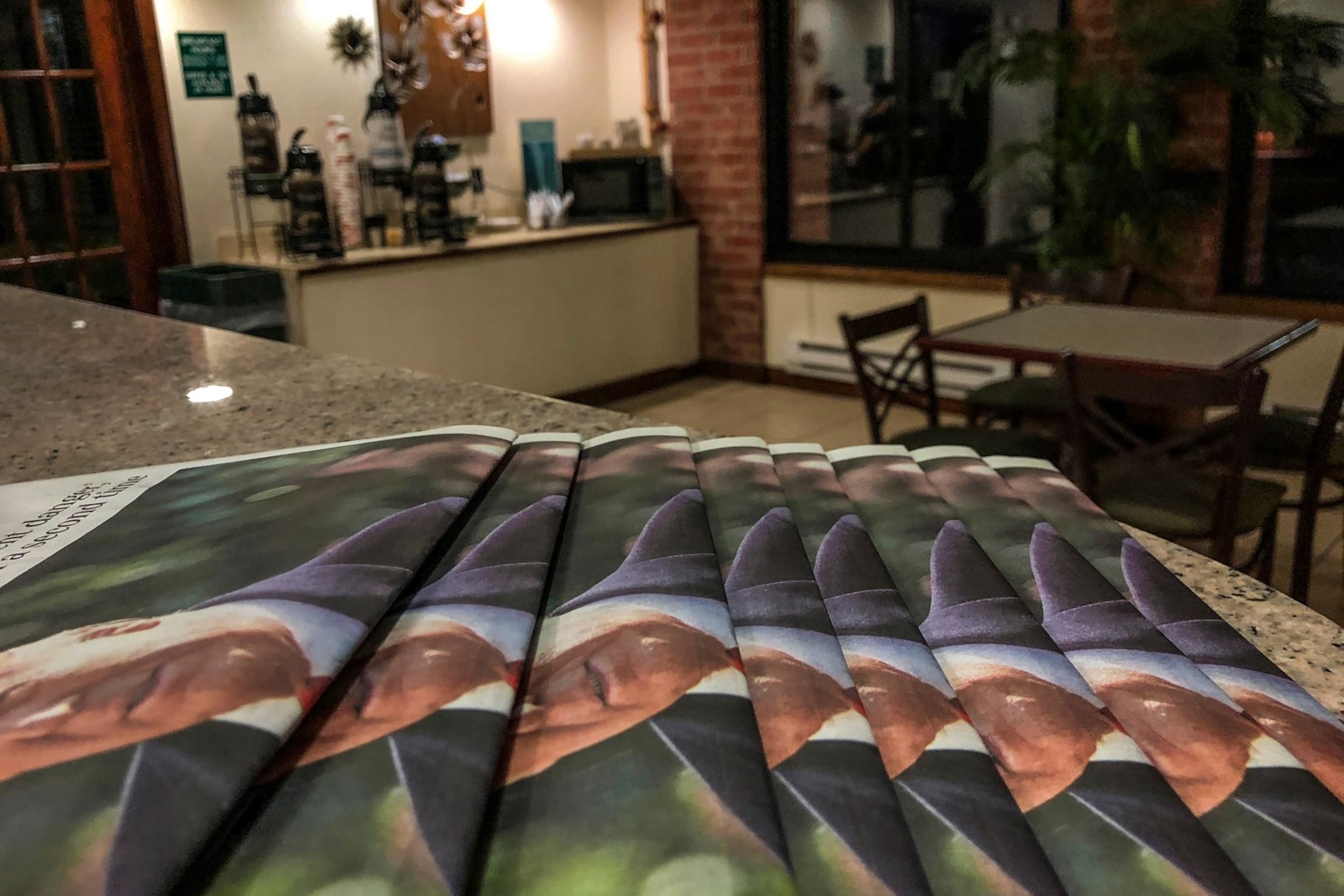 stacked newspapers showing Donald Trump's face