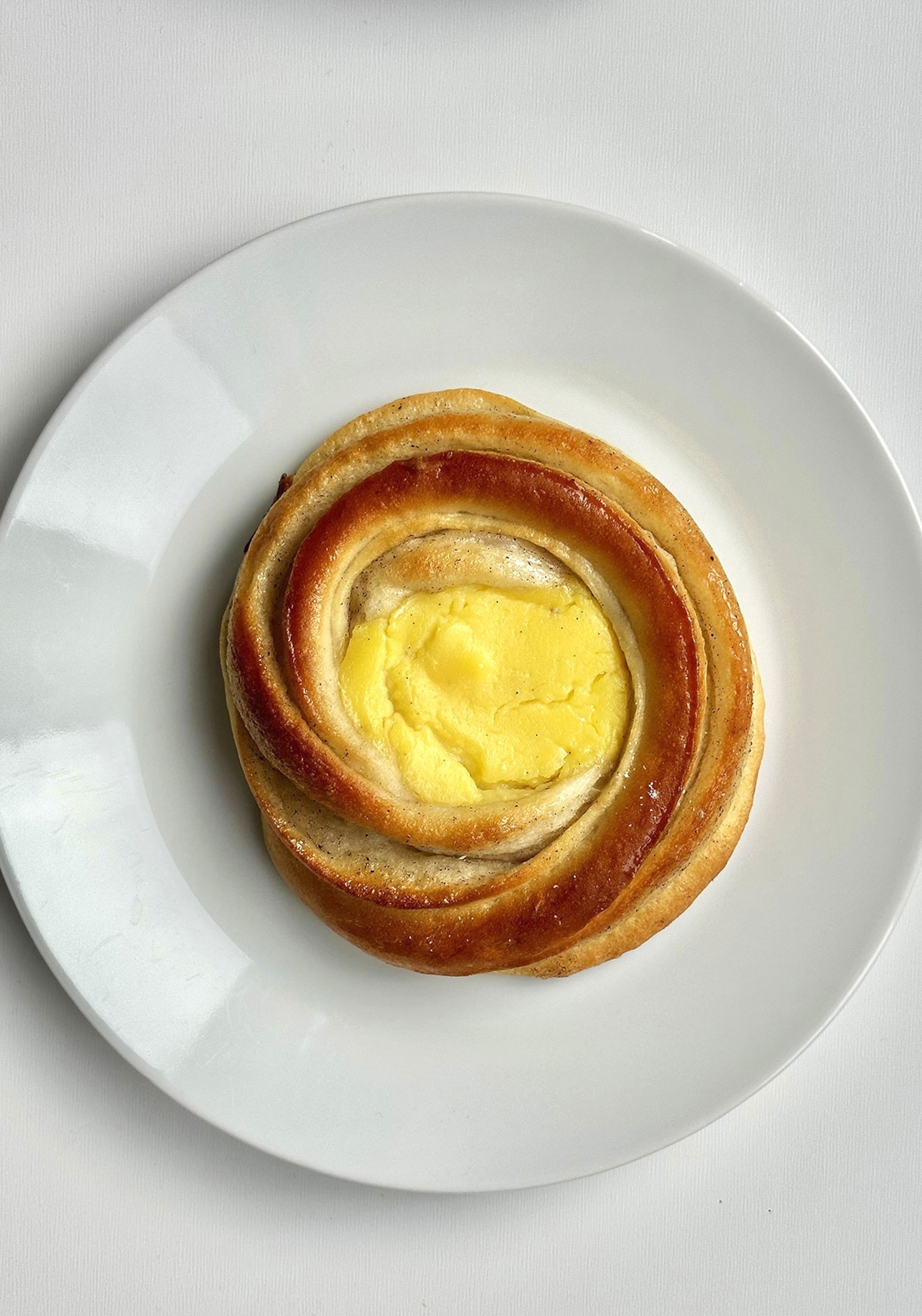 A pastry swirls in to a yellow center.