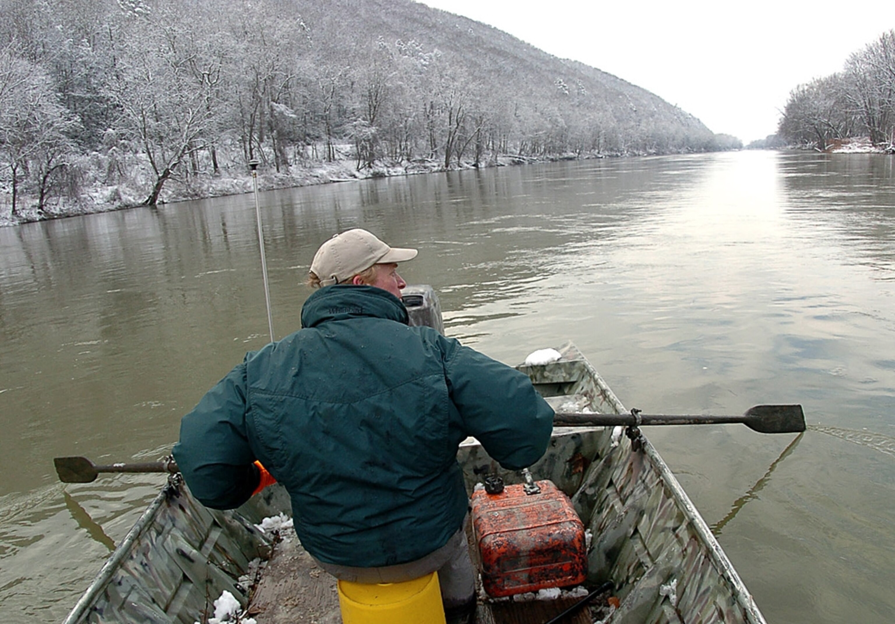 a man fishing from a boat