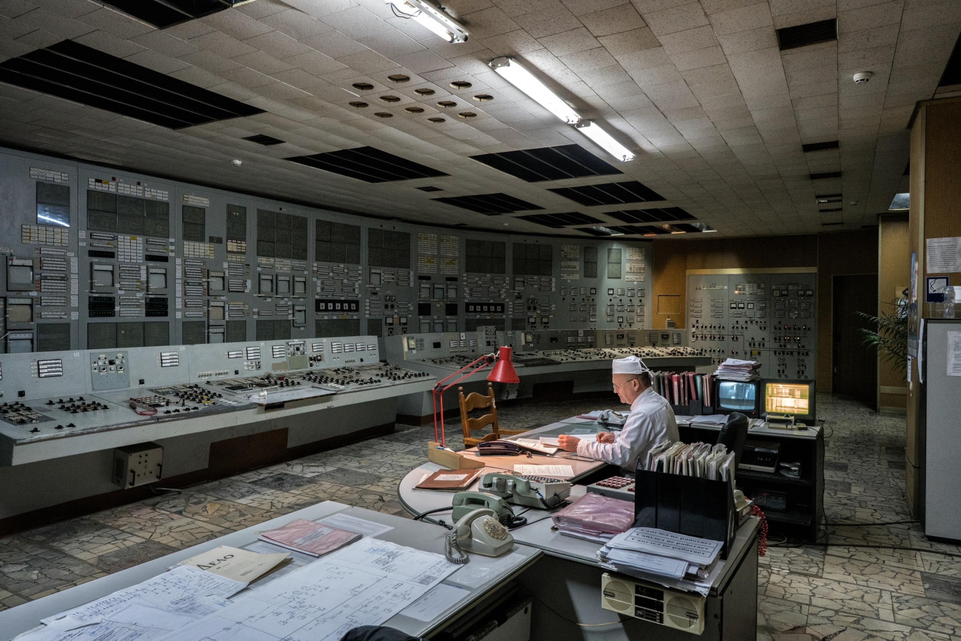Workers inside control room of reactor number 2. Chernobyl nuclear power plant,