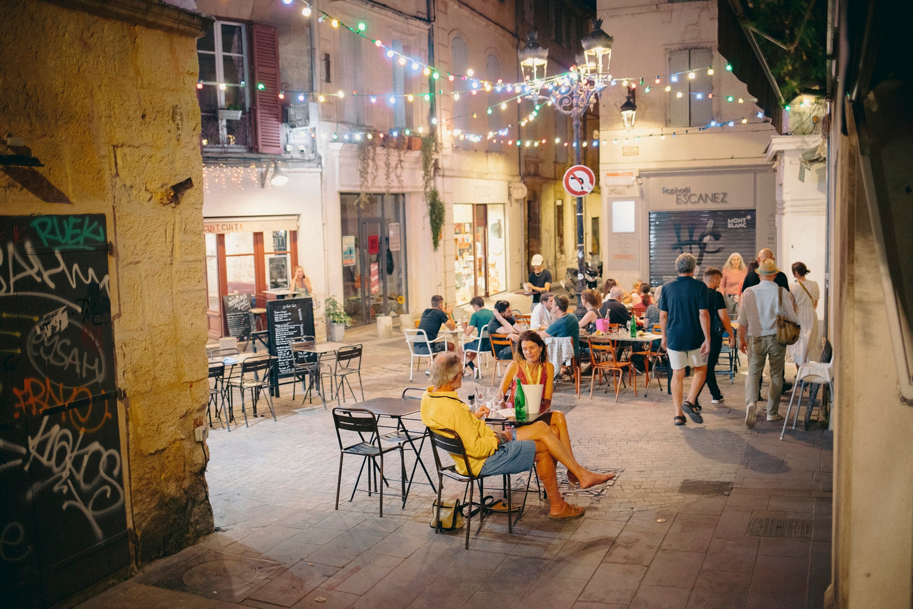 Street scene at night, in the city centre of Arles.