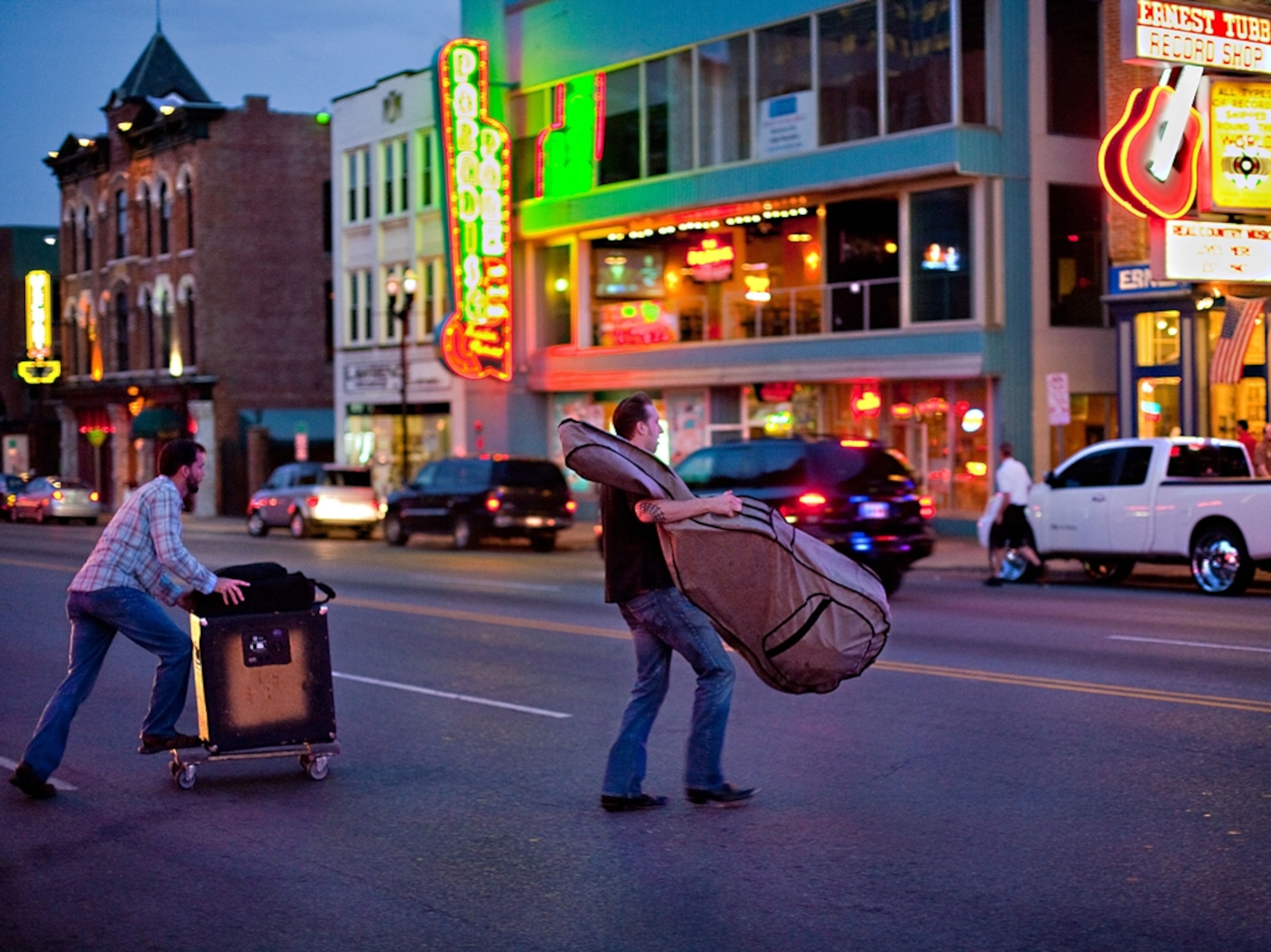 musicians hauling instruments from one venue to another, Nashville
