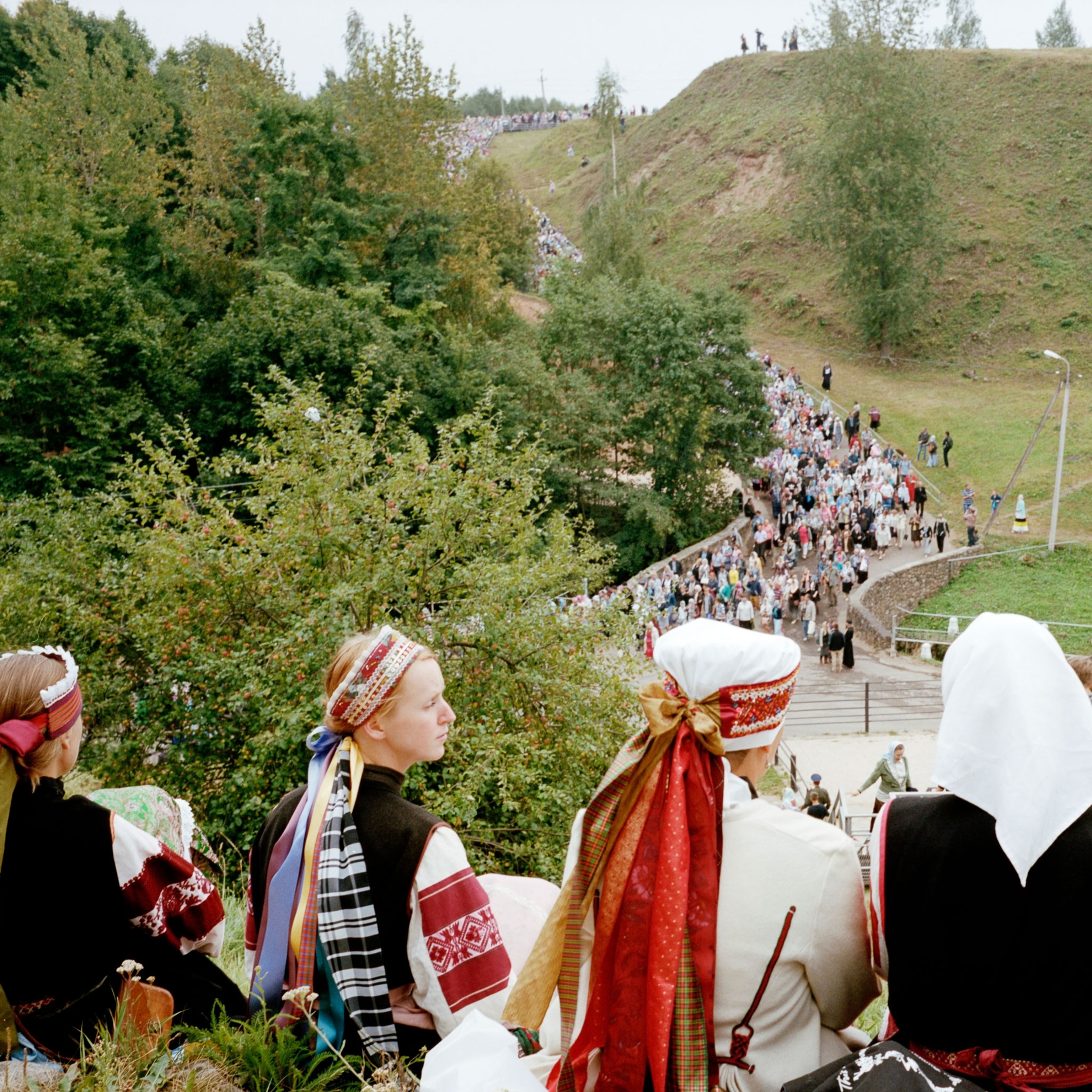 people gathering for the day of the dormition at a monastery