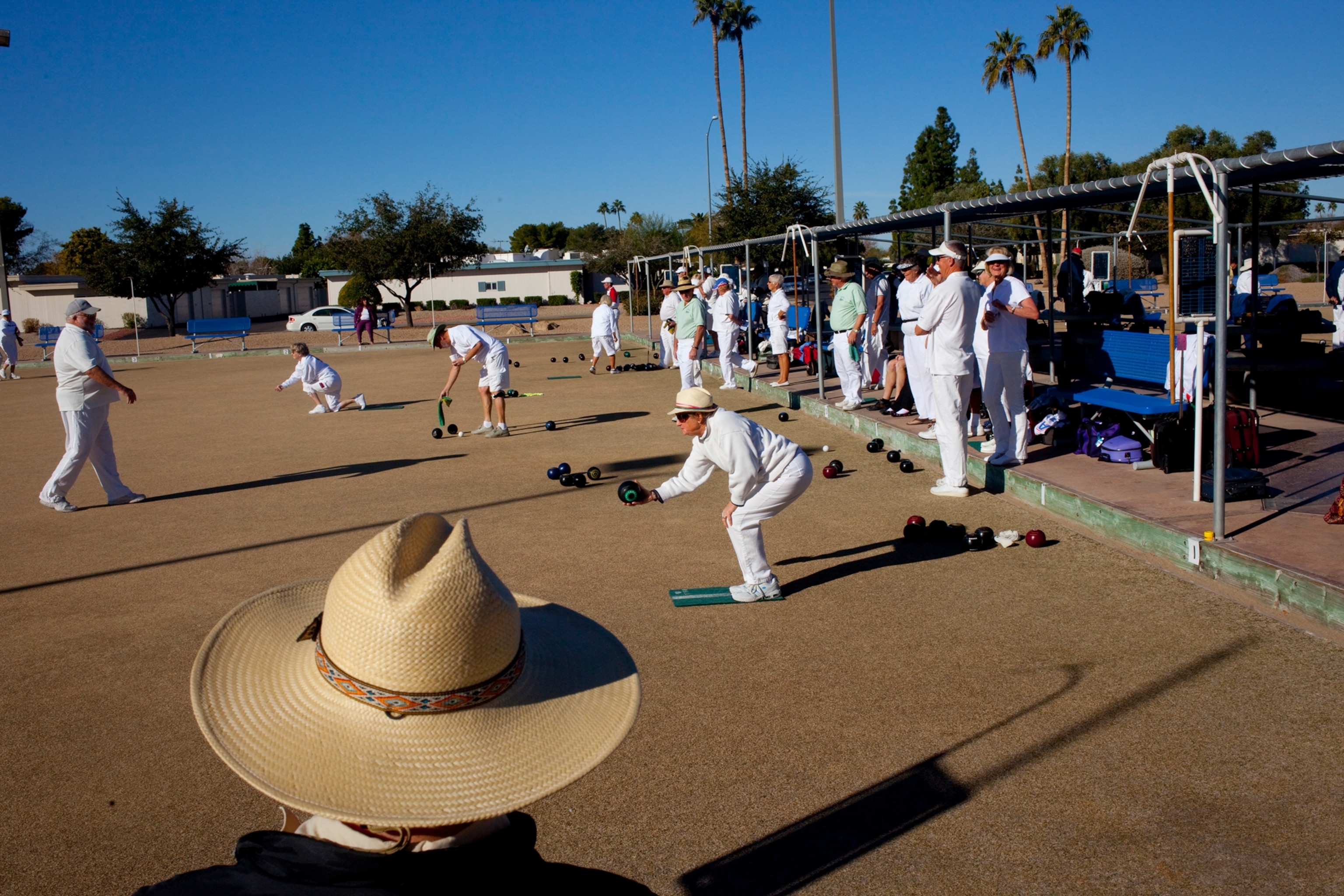 Picture of people dressed in all white playing game.