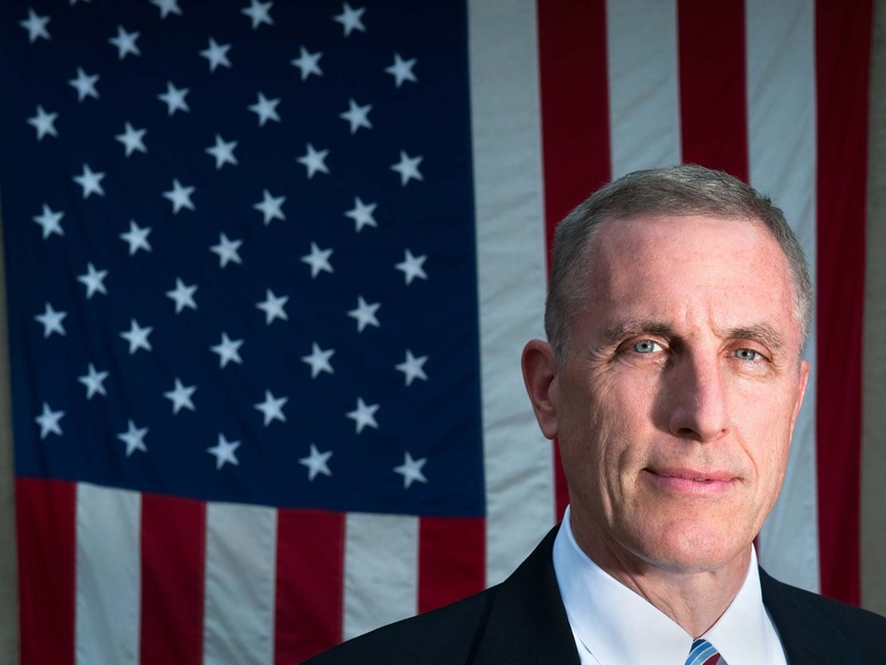 U.S. Representative Tim Murphy in front of a flag in his office in Mount Lebanon, Pennsylvania.