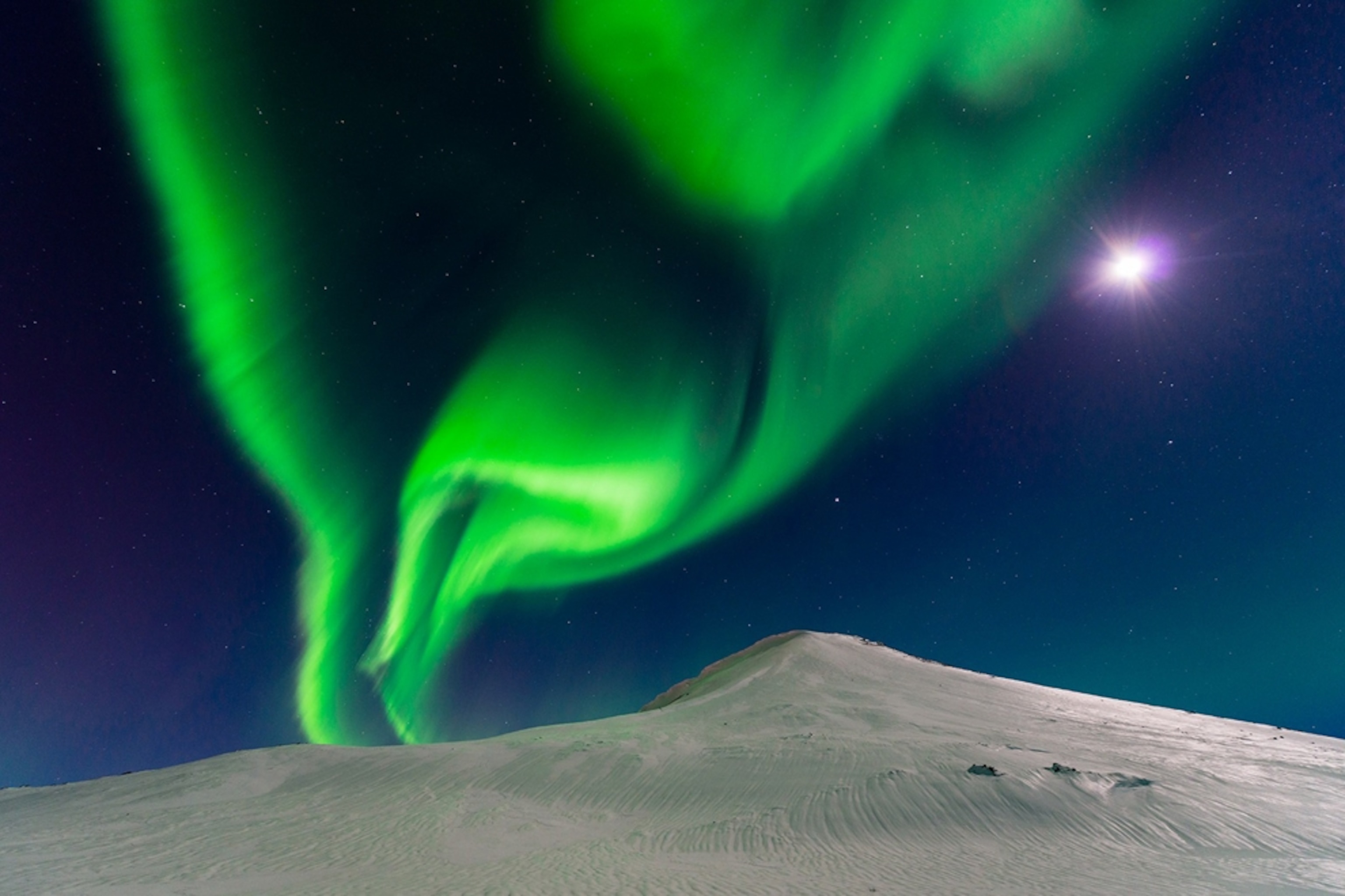 aurora borealis in Iceland with moonlight.
