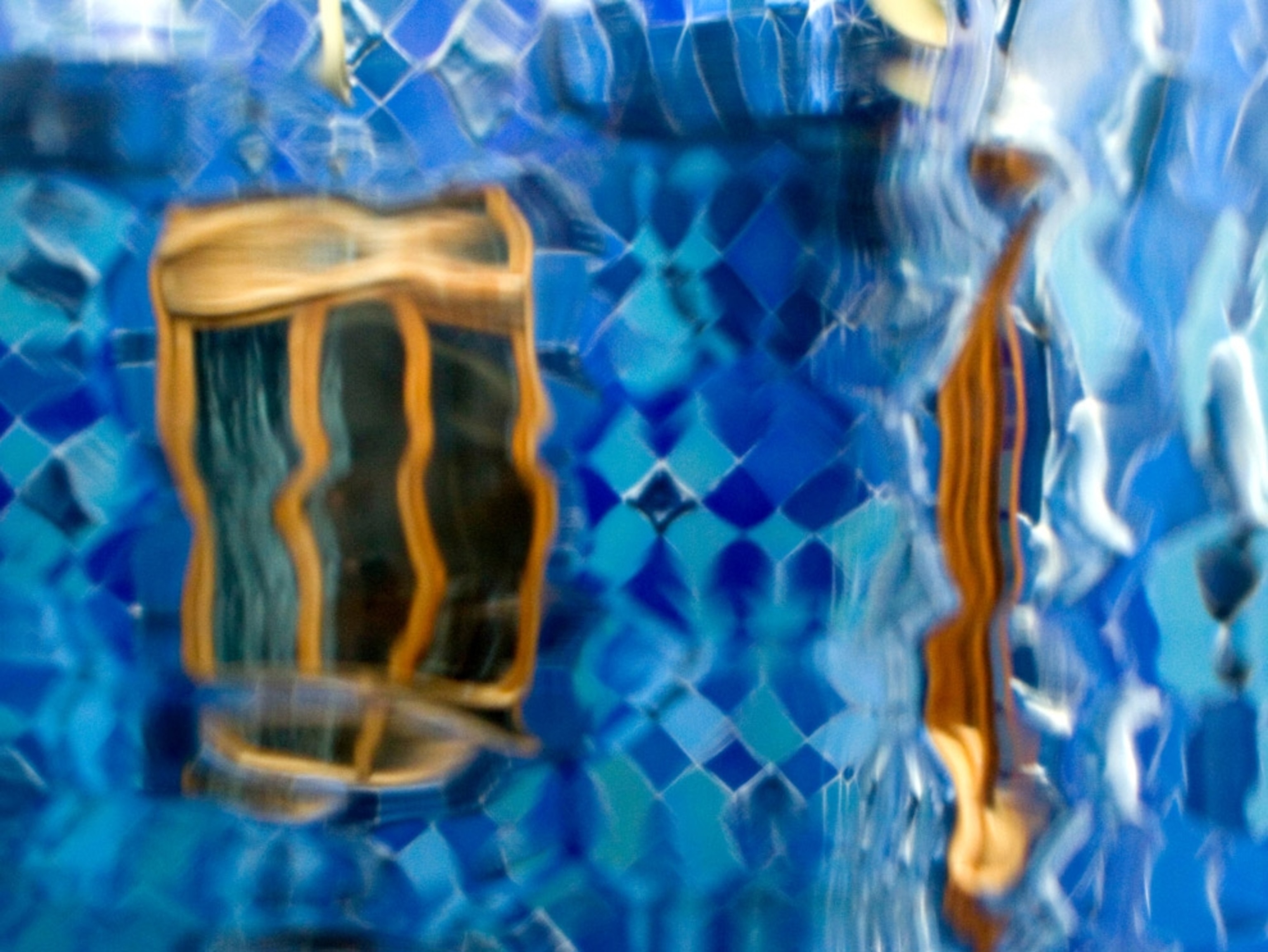 Looking through the distorted glass in Antoni Gaudi's Casa Batllo, Barcelona, Spain