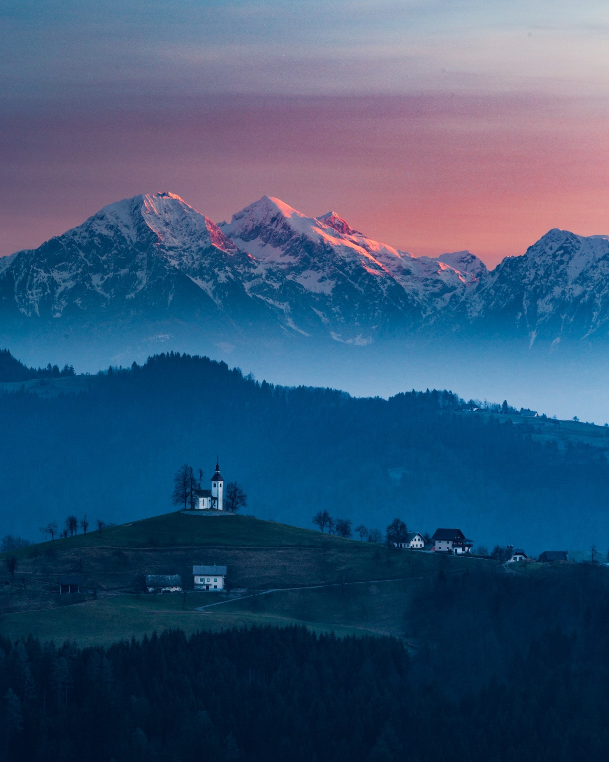 sunrise over St Thomas Church in Slovenia