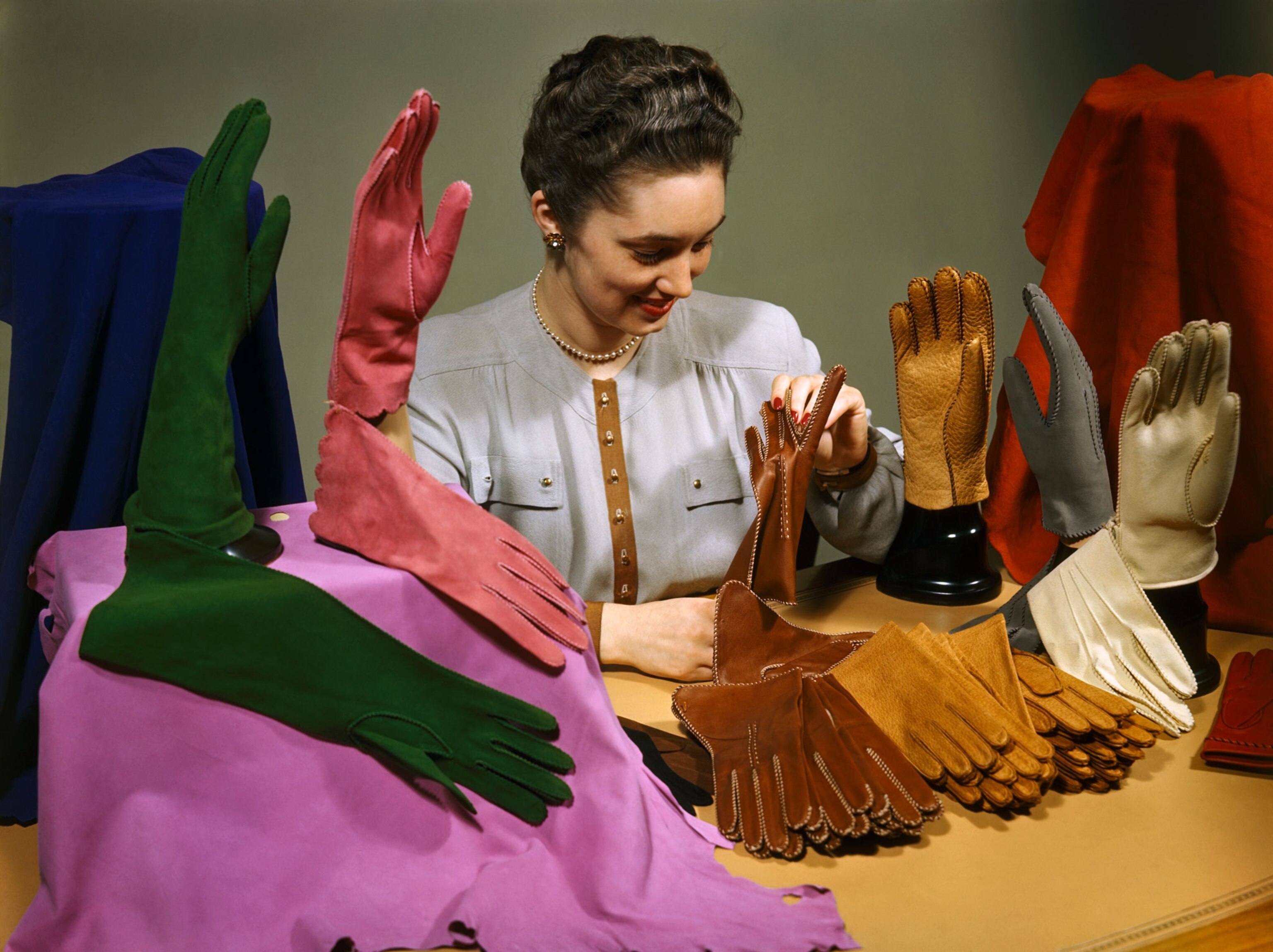 a woman looking at gloves