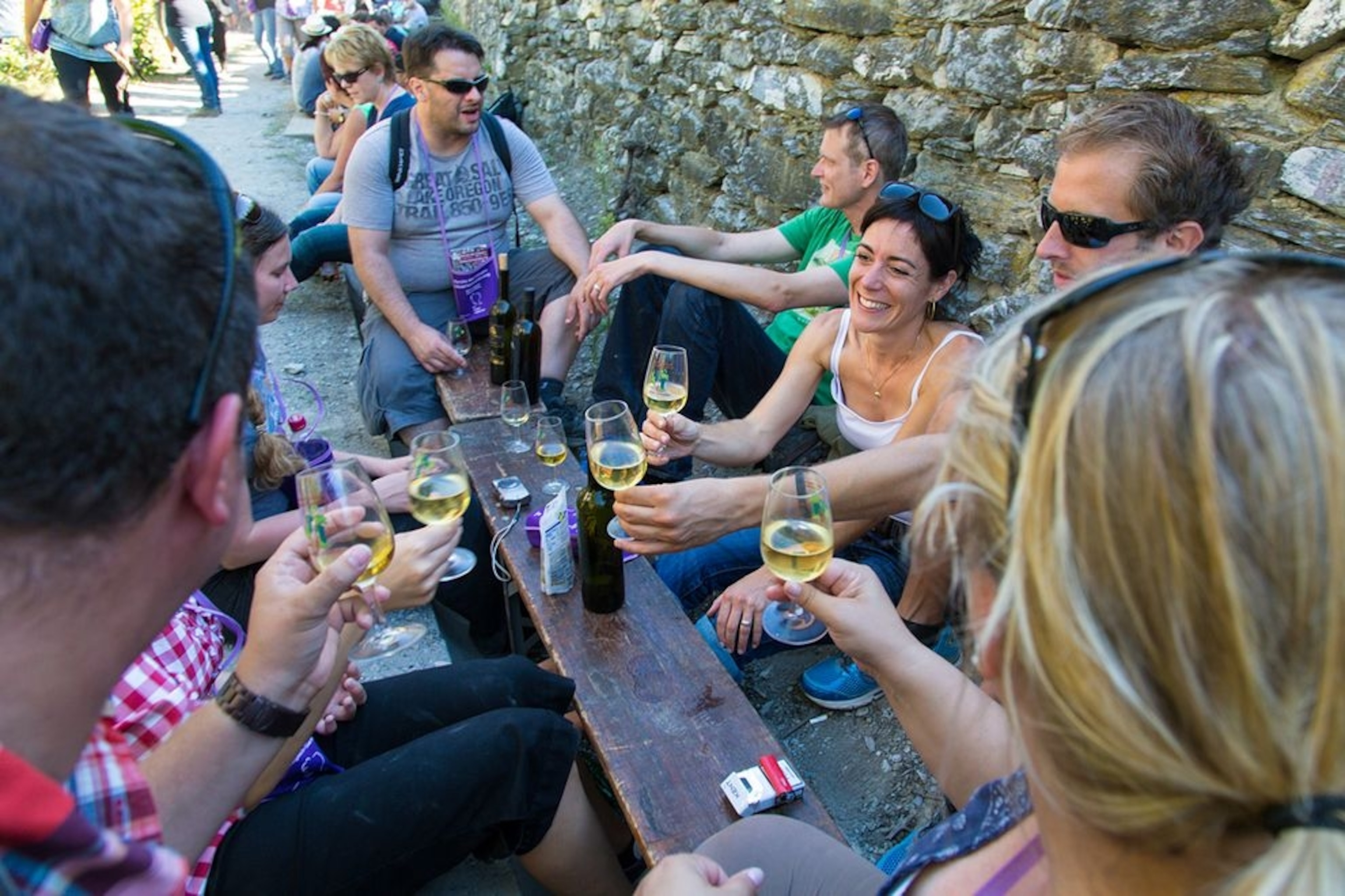people drinking wine during the Marche des Cepages near Salgesch, Switzerland