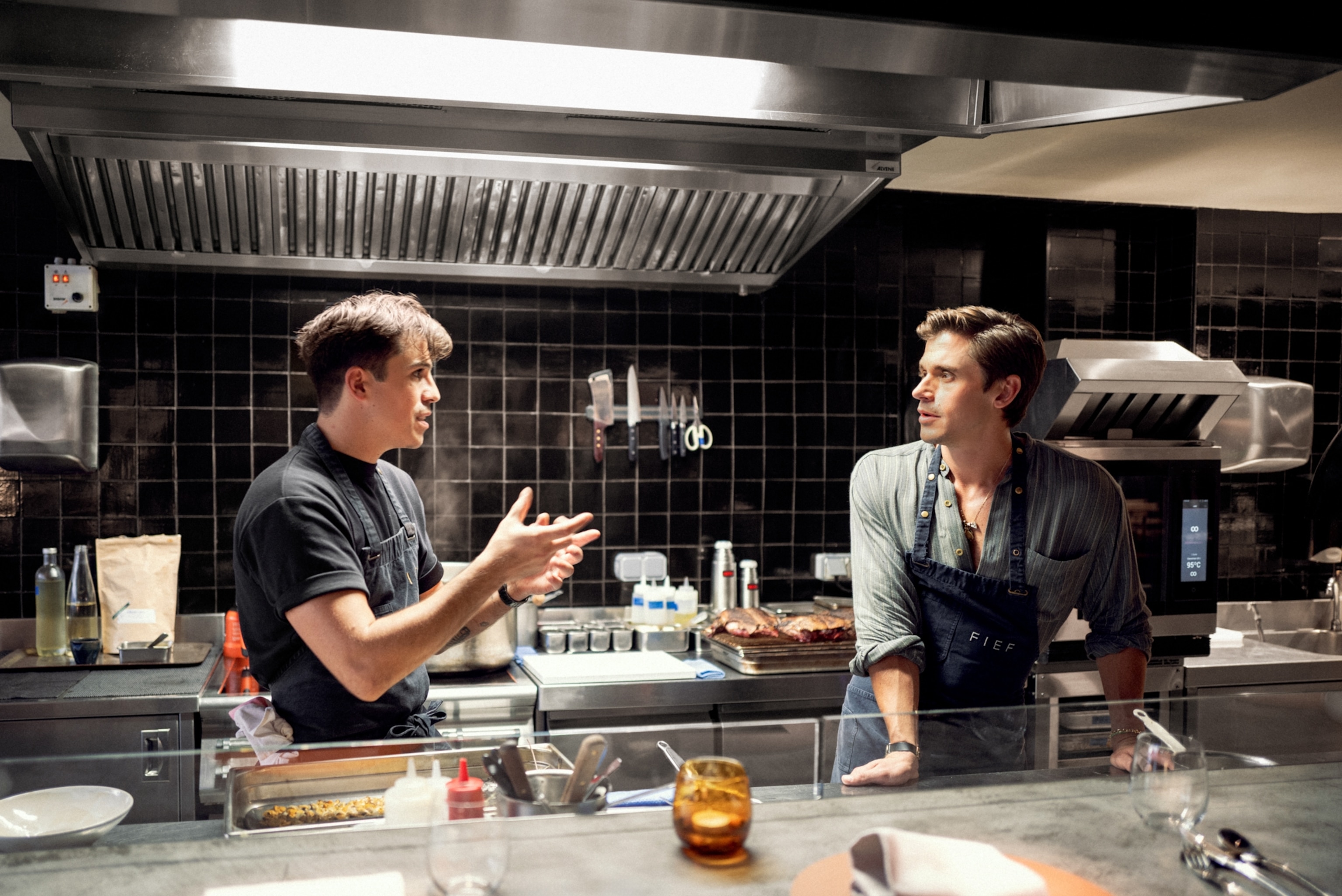 Victor Mercier, chef and owner of FIEF restaurant, chats with Antoni Porowski in the kitchen.