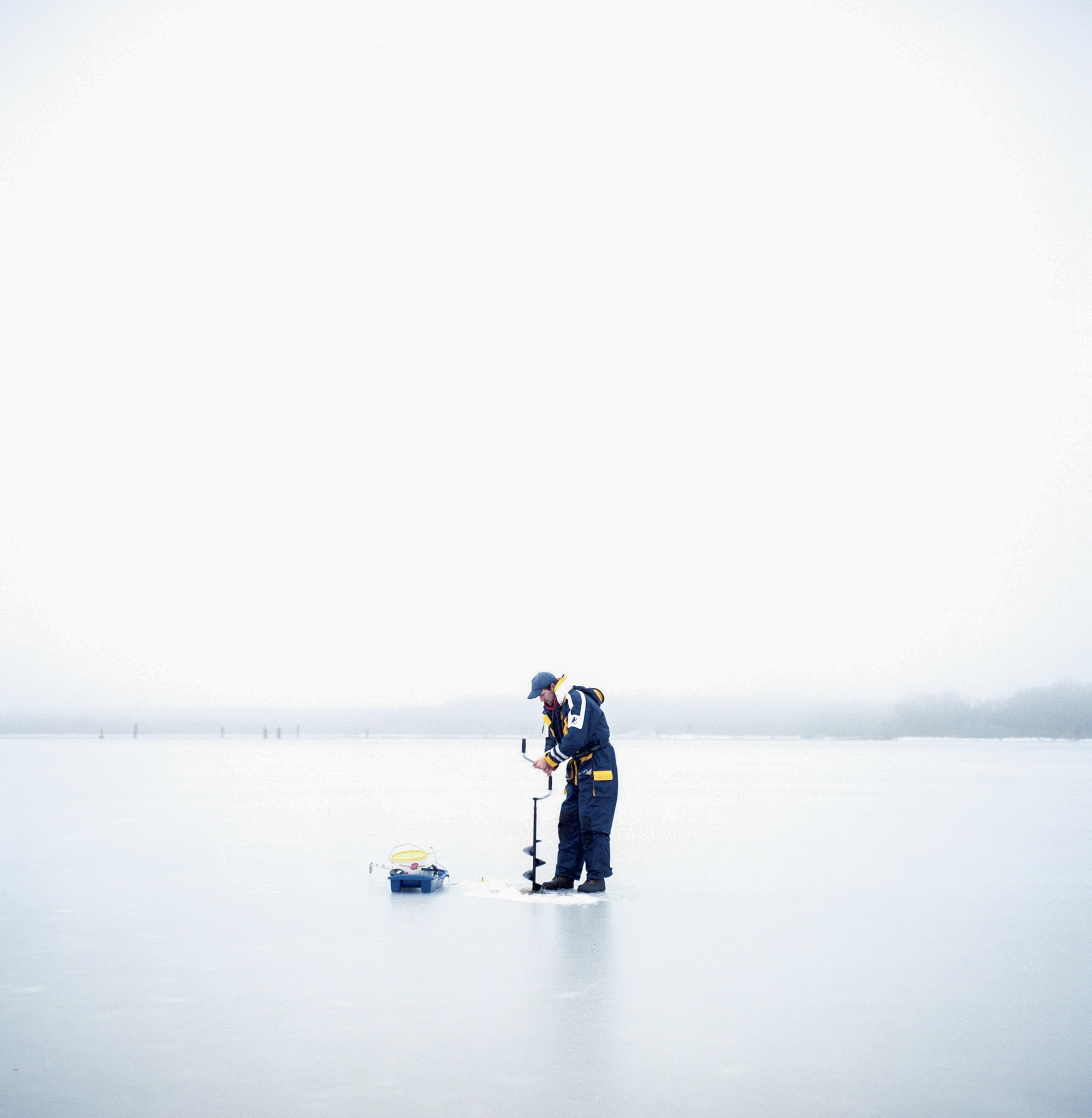 a man ice fishing in Sweden
