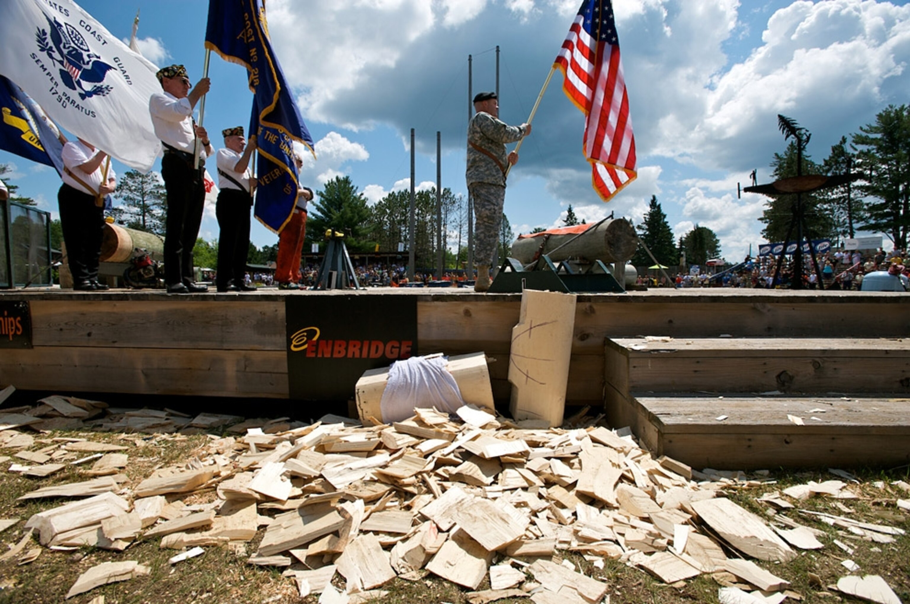 Men holding flags on platform